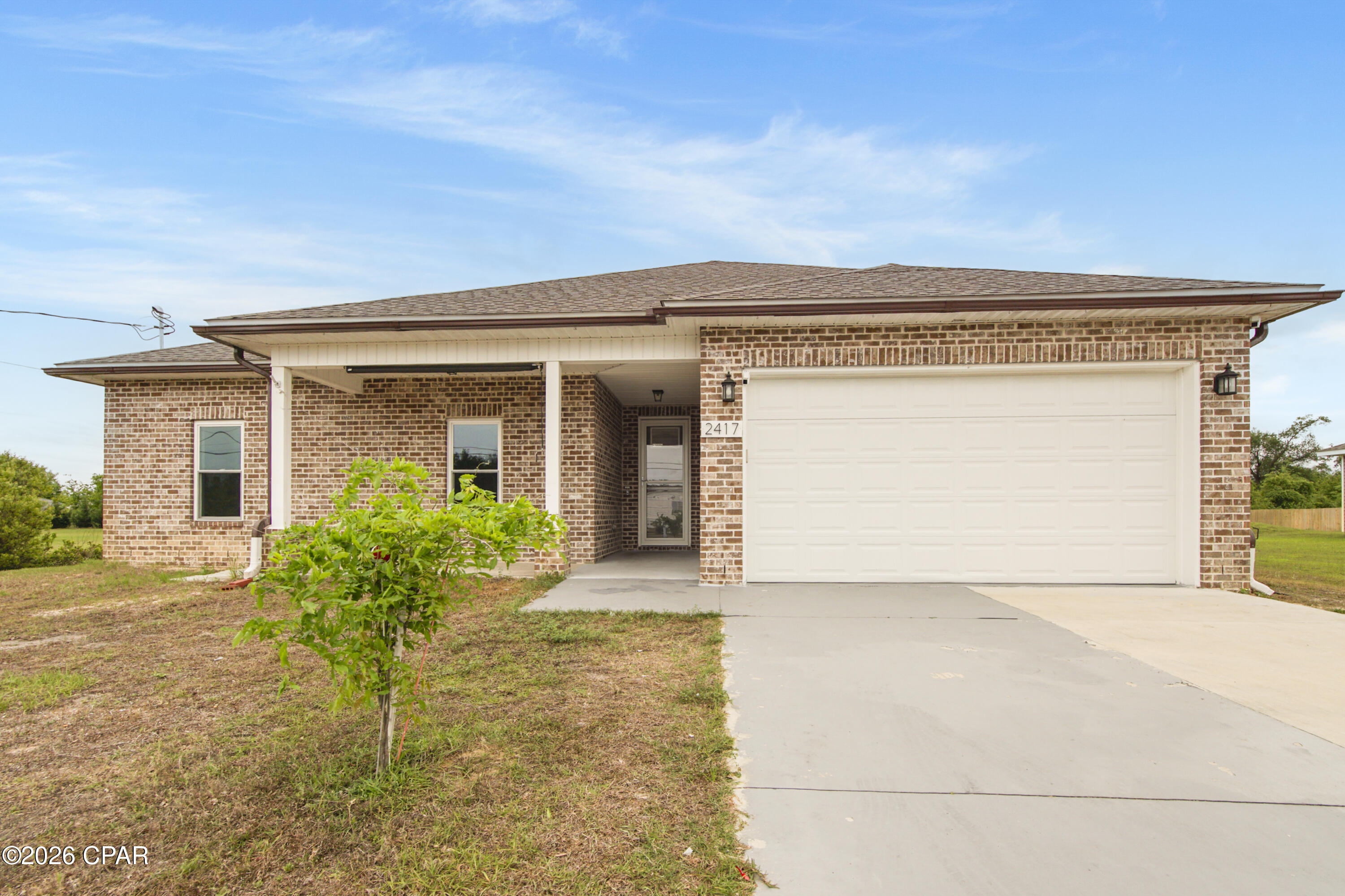 Well-maintained 4-bedroom, 2-bath home in desirable Lynn Haven, built in 2023 and situated on over half an acre with no HOA, offering space, flexibility, and room for boats, RVs, or future additions. 

Located on a quiet, dead end street, this newer construction home was built with modern standards and construction upgrades that enhance durability, efficiency, and overall peace of mind.

Inside, you'll find a spacious, split-bedroom floor plan, with LVP floors throughout and tray ceilings in multiple rooms that add character and style. The spacious primary suite features a large walk-in closet and an en-suite bath with his and her sinks, while the guest bathroom includes a double vanity for added convenience.

Enjoy the added versatility of an enclosed back patio with windows and sliding glass doors, perfect for year-round relaxing or entertaining. The home also includes an upgraded water softener system and filtered kitchen sink water, ideal for well and septic living, along with an elevation certificate that may offer insurance benefits.

The expansive yard provides plenty of room to enjoy the outdoors, and the location offers convenient access to shopping, dining, and parks--all while being within walking distance to the popular Rails to Trails for biking, jogging, and outdoor enjoyment.

If you're looking for a newer home, space, and freedom without HOA restrictions, this property stands out. Buyer to verify all information. Information deemed reliable, but not guaranteed.