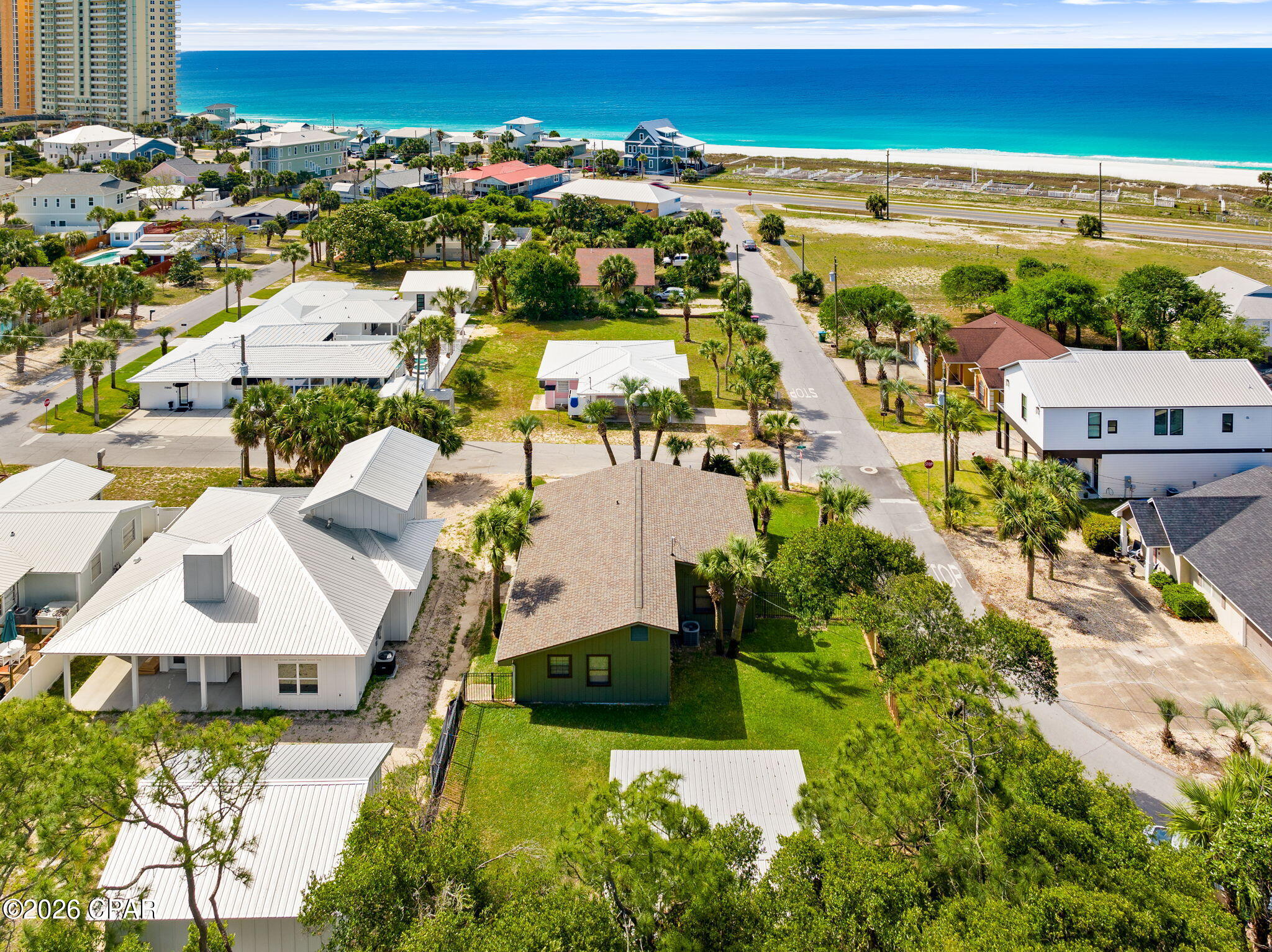 Charming beachside home located just one block from Panama City Beach. 
The home features an updated kitchen with stainless steel appliances, modern countertops, and quality finishes, along with updated bathrooms showcasing elegant tile work. A versatile flex room provides the option for a third bedroom, home office, or additional living space.
The exterior offers a large fenced backyard with well-maintained grass, providing ample space for outdoor activities and room for a pool. Additional features include an outdoor shower, landscape lighting, a storage shed with covered seating area, attached garage, and additional covered parking.
Enjoy a Gulf view from the property and take advantage of the prime location near Pier Park, local dining, shopping, and entertainment, with convenient access to the 30A area.
Recent updates include a new roof installed in July 2024 with a 10-year, 130 MPH warranty, and an A/C unit approximately 6 years old.
This property presents an excellent opportunity for a primary residence, second home, or investment property in a highly desirable beachside location.