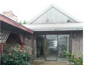 Quaint ranch located just blocks from the Gulf! Private backyard with covered patio! Kitchen/dining room combo with sliding glass door leading to backyard! Spacious living room! 2 spacious bedrooms! Whether you are looking for a vacation home or permanent residence look no further! Don't miss out on this great opportunity! Show and submit your offer today!
