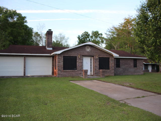 PRICE REDUCTION!!! Nice large home in the country. There is a patio and gazebo in back and it comes with a 3 room 600 sq.ft. guest house built in 1991! You will be getting 2 for 1 with purchase of this property!! The main house has 4 bedrooms and 2 baths. The master suite is just waiting to be finished. The large living room has a beautiful stone fireplace. There is a 2 car attached garage. The location is just a short drive into Graceville for all local amenities.
