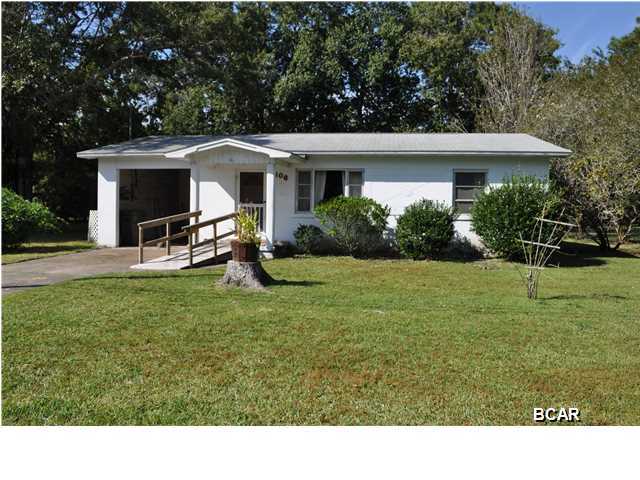 SELLER MOTIVATED! Charming cottage style home in Lynn Haven just 3 blocks from the bay! The walls and ceiling are all heart-of-pine and the flooring is hardwood. The home needs some updating, but it is located on a double lot so there is room to expand. The screened porch overlooks a tranquil backyard perfect for those who love to feed the birds and squirrels. The neighborhood is quiet and very family-friendly and you're walking distance to a large community park with a playground, picnic-pavilions, ball field and a public boat ramp on St. Andrews Bay. The roof was replaced in 2008. All info is approx. and must be verified by Buyers if important.
