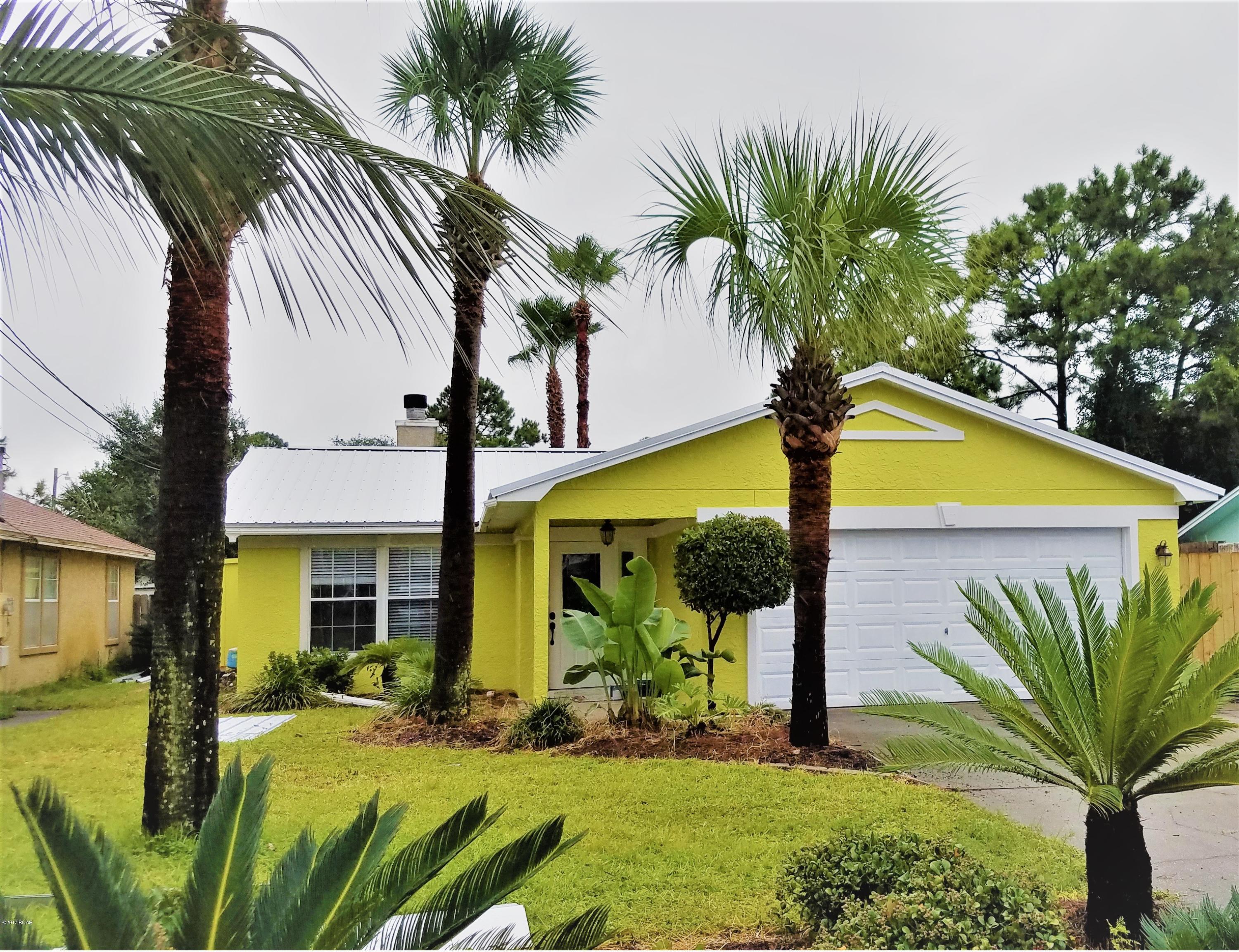 Adorable home located just blocks from the beach, boat launch, and shopping. Home has ceramic tile and hardwood floors, fireplace, Florida room with custom built bar and tongue-and-groove detail, spacious kitchen with all stainless steel appliances, 2-car garage, screened porch and fenced yard.