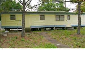 Partailly furnished home with open floor plan, washer, and all electric. 2 blocks from the beach! Water, sewer, garbage, and yard maintenance included.