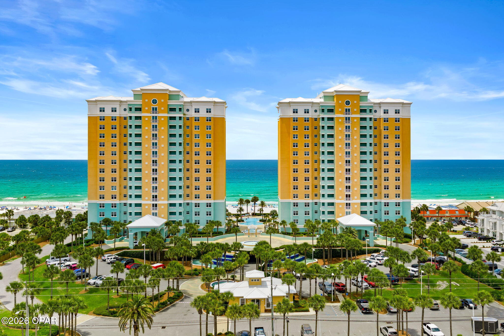 Welcome to En Soleil - one of Panama City's most EXCLUSIVE gulf front condominiums. This spacious home offers coastal elegance with panoramic views of emerald waters and sugar-white beaches. New double front doors and a beautiful crystal chandelier at the entrance give the first hints of luxury. Designed for easy living, this exceptional residence features an open layout with expansive floor-to-ceiling glass doors which open to a large, private balcony. (Glass doors were specially tinted for comfort and energy savings). A built-in gas grill and outdoor furnishings provide a special place to relax and enjoy the endless Gulf views. With elegant finishes, soaring ceilings, beautiful lighting and upscale decor, there is an atmosphere of fine living throughout. Gather around the beautifully updated fireplace, featuring new gas logs, new mantle, and custom shiplap finish. Designed as a stunning focal point, this rare feature is perfect for cozy, romantic evenings. Remote-controlled blackout shades installed in the living room and primary bedroom, as well as custom drapery, are additional amenities. Fresh paint from top to bottom gives this unit a clean, crisp feel. The large kitchen was just remodeled with beautiful, premium cabinetry, Taj Mahal quartzite countertops and backsplash, new hardware, an oversized breakfast bar (ideal for entertaining) and stainless steel appliances. This unit also offers a large, separate laundry room with a new sink and faucet, a new directional light and a walk-in closet system for extra storage.

The primary bedroom is a special retreat with balcony access, a spa-inspired bathroom, and generous closet space. New ceiling fans have been installed in both bedrooms. The primary bathroom has been completely upgraded with resurfaced cabinets and new drawers, wall-to-wall lighting above the mirror, new hardware and new glass shower enclosure. New exhaust fan systems and new toilets have been installed in both bathrooms. The guest bedroom offers privacy and comfort with fresh bedding, curtains and lamps. Its adjacent bathroom has also been remodeled with a new cabinet, mirror, crystal light fixture, hardware and plumbing, and shower curtains. Yes, everything is fresh and new! You must see this exquisite residence to appreciate the many upgrades and fine finishes. Beautifully remodeled - ready to move in and enjoy!

En Soleil is known for its resort-style amenities and low density exclusivity. With only three residences on each floor, dedicated covered parking, 24-hour security, and gated entry, life is peaceful and private! Owners enjoy well-manicured grounds, decorative fountains, resort style pools, and a well-equipped fitness center. En Soleil is situated on the quiet, east end of Panama City Beach and close to fine dining, several marinas, golf, shopping, and entertainment. If you are seeking a primary residence, second home, or premier investment opportunity, this extraordinary waterfront condominium delivers unmatched beachfront living.