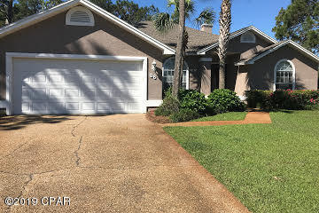 Large corner lot in the Glades subdivision with beautifully manicured yard and immaculate salt water pool in an enclosed lanai surround this home.  Enter the home through the beautiful lead glass door into the great room with new flooring, fireplace and built in bookcases,  which then open into the dining room and kitchen with breakfast counter.  The large master bedroom overlooks the enclosed pool; the master bath features new flooring, double vanity, newly tiled double shower,separate jetted tub, and a giant walk in closet.  The second bedroom is also large and boasts of double closets for ample storage.