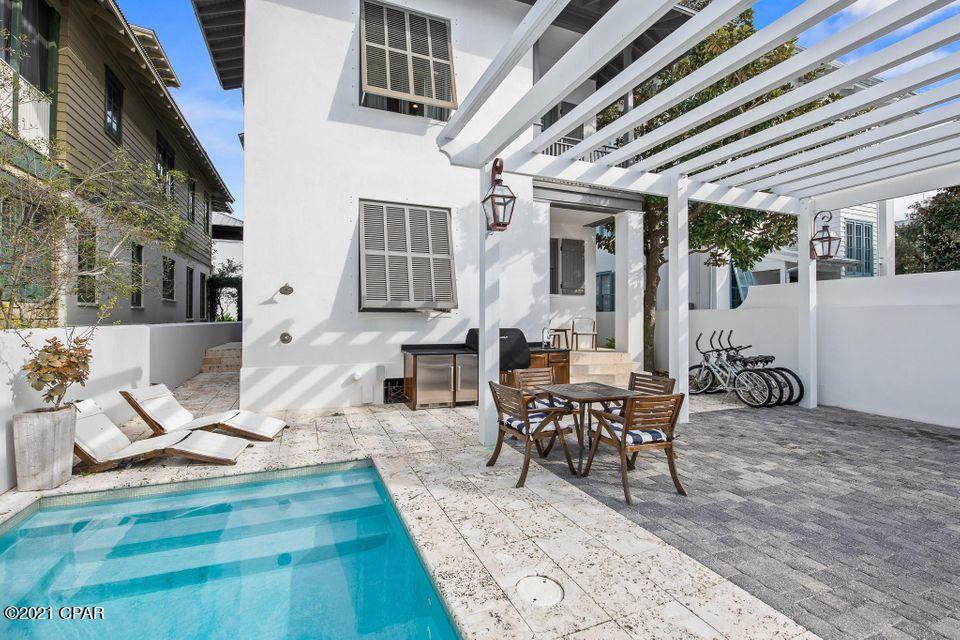 Poised just four tiers from the beach on Rosemary's Gulf side, this exquisite custom home with private pool boasts a highly coveted location just 100 steps to both the beach and Rosemary's lively Town Center with all of its amenities, restaurants, and shopping. ''Rosemary Bluegrass'' was renovated from the ground up in 2017 by renowned custom home builder Matt Fuller and interior design firm Kay Fuller and Sons, using impeccable finishes that exude a high-design beach house with crisp coastal elements. Elegantly constructed with attention to every detail, the home has jaw-dropping finishes utilizing reclaimed barn-wood from the Bluegrass Country of Kentucky...



Hand-hewn beams adorn the vaulted ceiling in the living area and master bedroom. Other accents include vintage oak flooring & do