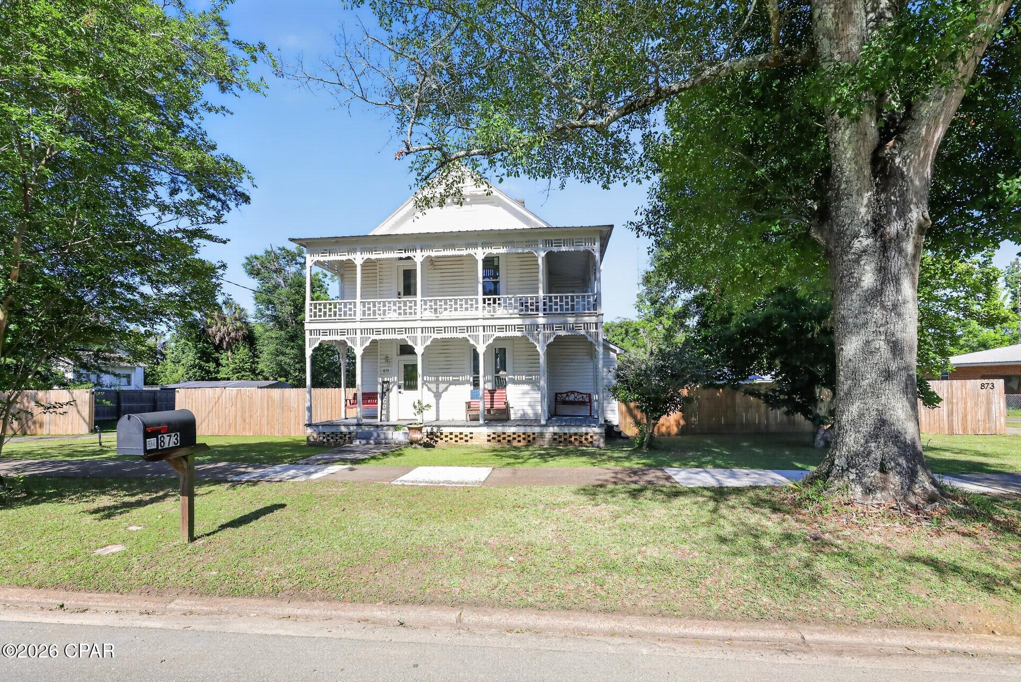 Beautiful historic home in the heart of Chipley! Built in 1902, this 4-bedroom, 2-bath, two-story home with approximately 2,114 sqft showcasing original hardwood floors, tall ceilings, multiple living areas, and classic Southern charm. Recent improvements include energy-efficient windows and doors, updated bathrooms, privacy fence, and porch improvements. Features include a functional kitchen, screened porch, fenced backyard, mature trees, city water/sewer, and detached garage with electric. Move-in ready with older finishes and plenty of upside.