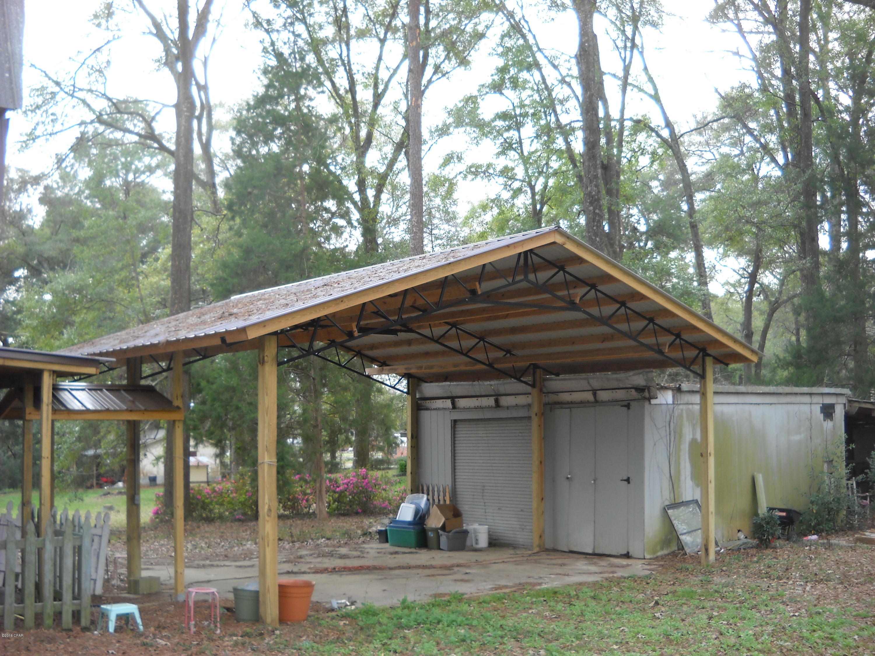 This will be an excellent site for your new home.  Located in the Sneads elementary and High School district and Grand Ridge for Middle School district.  Property is off the main road for privacy but just moments from highway 90 for an easy commute to work.  Property has pole barn or potential carport with attached structure. Property has structure that was previously a detached single family residence, but was ruled total loss.  No value is being assigned to condemned structure.  Call today to schedule your appointment for viewing.