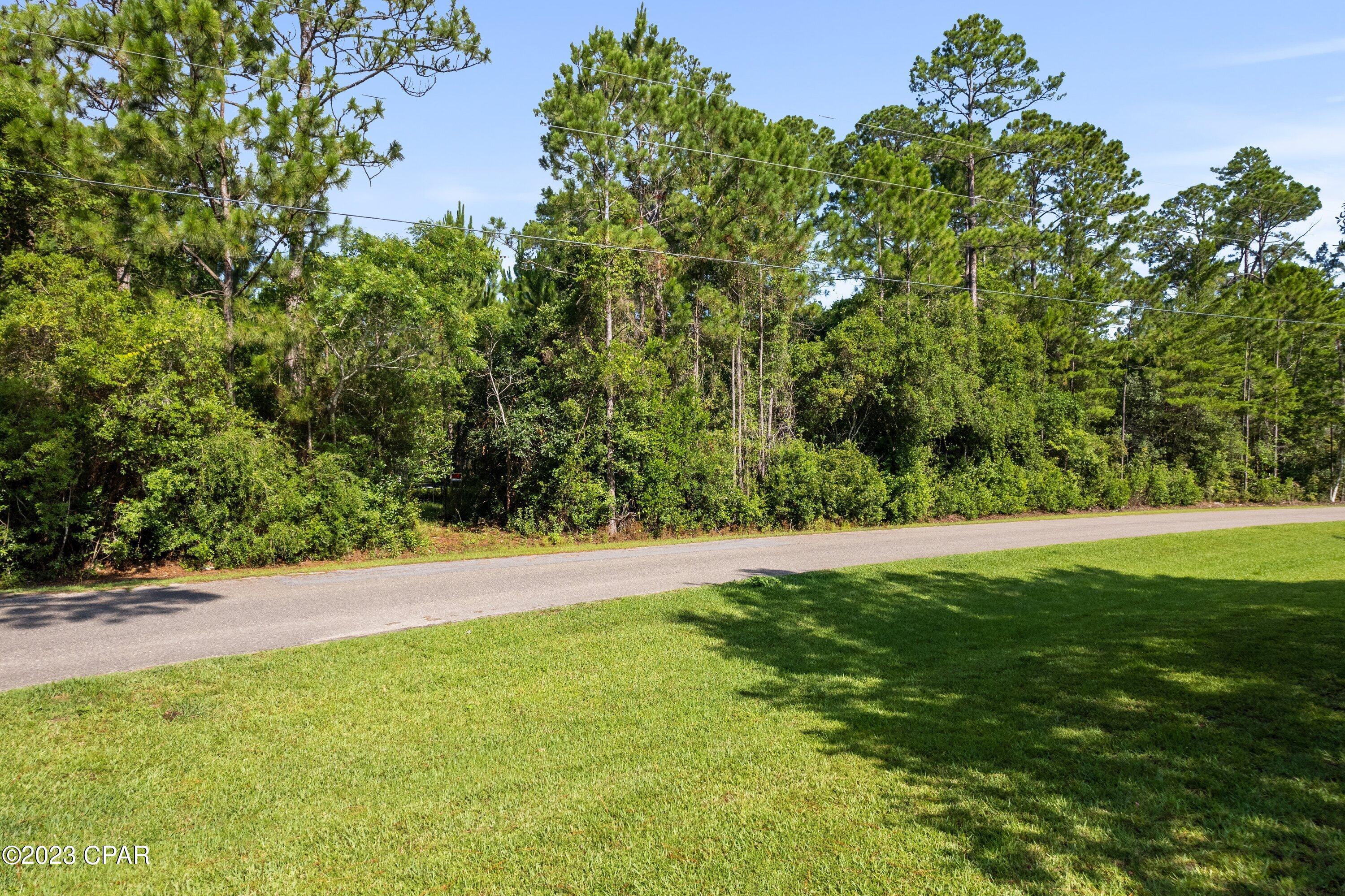 Create your ideal coastal retreat in the highly desirable Bay Pine Shores community of Santa Rosa Beach. This oversized homesite, spanning nearly half an acre, offers a rare combination of space, flexibility, and location. With low HOA fees and no required build-out timeline, you have the freedom to design and build on your schedule.

Conveniently located just minutes from 30A, Highway 331, and the white-sand beaches of South Walton, the property provides easy access to some of the area's best dining, shopping, entertainment, and outdoor recreation while still maintaining a peaceful neighborhood feel.

The surrounding area continues to see exciting growth and investment, including a newly approved 10,000-seat amphitheater planned just a few miles away, as well as a future scenic development featuring lakes and walking trails enhancing both lifestyle appeal and long-term value.

With very few homesites of this size remaining in Bay Pine Shores, this is a rare opportunity to secure a spacious property in one of South Walton's fastest-growing areas. Whether you're planning a primary residence or second home, this lot offers exceptional potential in a prime coastal location.
