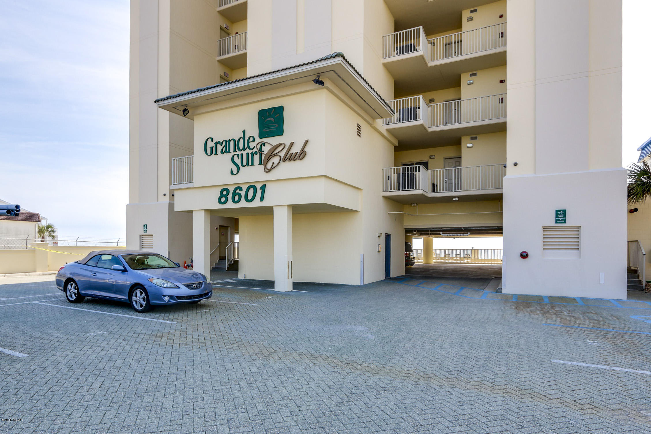 Located directly on the “World’s Most Beautiful Beach”, Grand Surf Club is a small, gated community that offers what most other condos along the beach can’t… PRIVACY!!  With only 2 units per floor, 26 in the entire building, you can relax & enjoy the beach or time at the gulf front pool away from the crowds. 9E is a beautifully decorated, meticulously maintained & will surpass all your expectations. The massive balcony not only allows for everyone to gather & enjoy the view, it also offers a natural gas connection allowing the grill master to show off his skills without having to leave the party. A large living room with a floor to ceiling windows allows the view to come inside. A gulf front master suite allows you to wake up in the morning to the all the beauty the area has to o Add to all this a large kitchen complete with island, large pantry, breakfast bar, 2 additional bedrooms and 2 full baths, a gas fireplace, 9' ceilings, large laundry room, tons of storage, crown molding, like new furnishings and drapes and you have what everyone is looking for... the perfect beach retreat. This unit is unique in that it also includes an assigned, covered parking space.

As for the complex, it sits on a low traffic street just off the newly redesigned section of Thomas Drive which is now a beautiful boulevard with palm trees and sidewalks.  

Grand Surf Club is gated community with secured access to the parking lot as well as secured access to the elevators.  The building has the feel of a non-rental building although short terms rentals are allowed.  However, 9E has never been rented which is evident by the perfect condition of the unit.

To truly appreciate all that this unit has to offer, check out the interactive tour to take a stroll around the unit.  And then call to arrange your private showing.  I promise... you won't be disappointed.