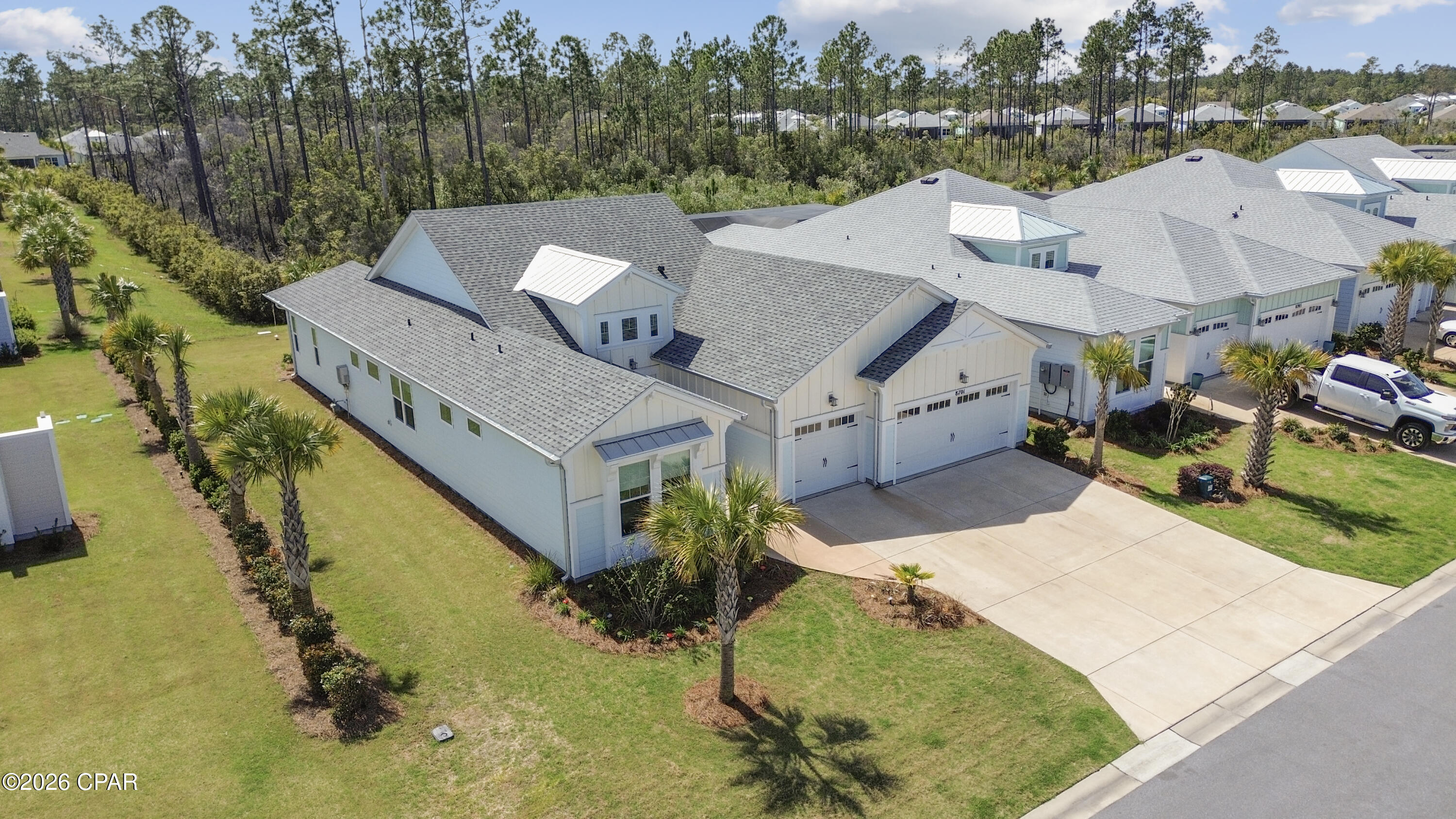 Significant price improvement! Seller offering some incredible incentives: $5K toward buyer closing cost, $10K toward closing cost for Veteran or Healthcare workers. Polywood outdoor furniture to remain ($15K value).

Welcome to this exceptional Trinidad Bay home in sought-after Phase 4 of Latitude Margaritaville Watersound, ideally situated on a beautiful private preserve lot along a quiet street comprised exclusively of Island Collection homes. This stunning residence offers thoughtfully designed spaces, extensive post-closing upgrades, and effortless indoor-outdoor living.

Step inside through a soaring two-story foyer highlighted by a custom coastal-inspired feature wall that sets the tone for the elegant finishes found throughout the home.

The heart of the home is the gourmet kitchen, designed for both everyday living and entertaining, featuring upgraded cabinetry, quartz countertops, custom tile backsplash, designer range hood, wall oven and microwave, and an oversized island perfect for gatherings.

The open concept layout flows seamlessly into a spacious dining room with a striking electric fireplace and custom accent wall, while the expansive living room boasts soaring cathedral ceilings and a dramatic wall of sliding glass doors that connect the interior to the outdoor living space.

A private den/office offers additional versatility and features a custom built-in bar with cabinetry and wine cooler, perfect for entertaining guests.

The luxurious primary suite offers a relaxing retreat with a spa-inspired bath and custom closets, while two additional guest bedrooms each feature their own en-suite baths, providing comfort and privacy for visitors.

The custom-designed laundry room is truly exceptional, featuring abundant cabinetry, a laundry sink, a built-in butler's pantry, and an additional refrigerator.

Enjoy Florida living on the extended screened lanai overlooking the peaceful preserve, the perfect setting for sunset views and evening cocktails. Outdoor furniture may convey with an acceptable offer.

Additional highlights include:

• 3-car garage with high-quality workshop

• RevWood by Mohawk laminate flooring throughout main living areas

• Casablanca ceiling fans and designer lighting throughout

• Electronic remote shades

• Custom feature walls in foyer and dining room

• Higher-level and custom cabinetry throughout the home

Many of these impressive upgrades were completed after closing, creating a home that feels truly one-of-a-kind. The property is priced below recent appraised value, presenting an incredible opportunity.

Located in the award-winning Latitude Margaritaville Watersound, residents enjoy world-class amenities including a private restaurant and bar, resort-style Paradise Pool, state-of-the-art Latitude Town Center, fitness center, pickleball and tennis courts, Barkaritaville Dog Park, live entertainment at the Bandshell, theater, wood-working shop, ceramics studio, walking and biking trails, and a full calendar of concerts, events, and social clubs.

Exciting growth continues nearby with a new hospital under construction and future commercial development including a Publix grocery store and additional shopping and dining options.

And best of all, the white sugar-sand beaches of the Gulf are just 7 miles away.

Experience the best of coastal resort living in Latitude Margaritaville Watersound, where every day feels like a vacation.