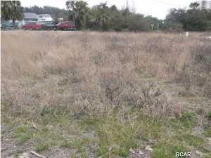 Walk to the beach from this oversized building lot within the first block off of Front Beach Road. Would make a wonderful site for your home! Centrally located near Pier Park.