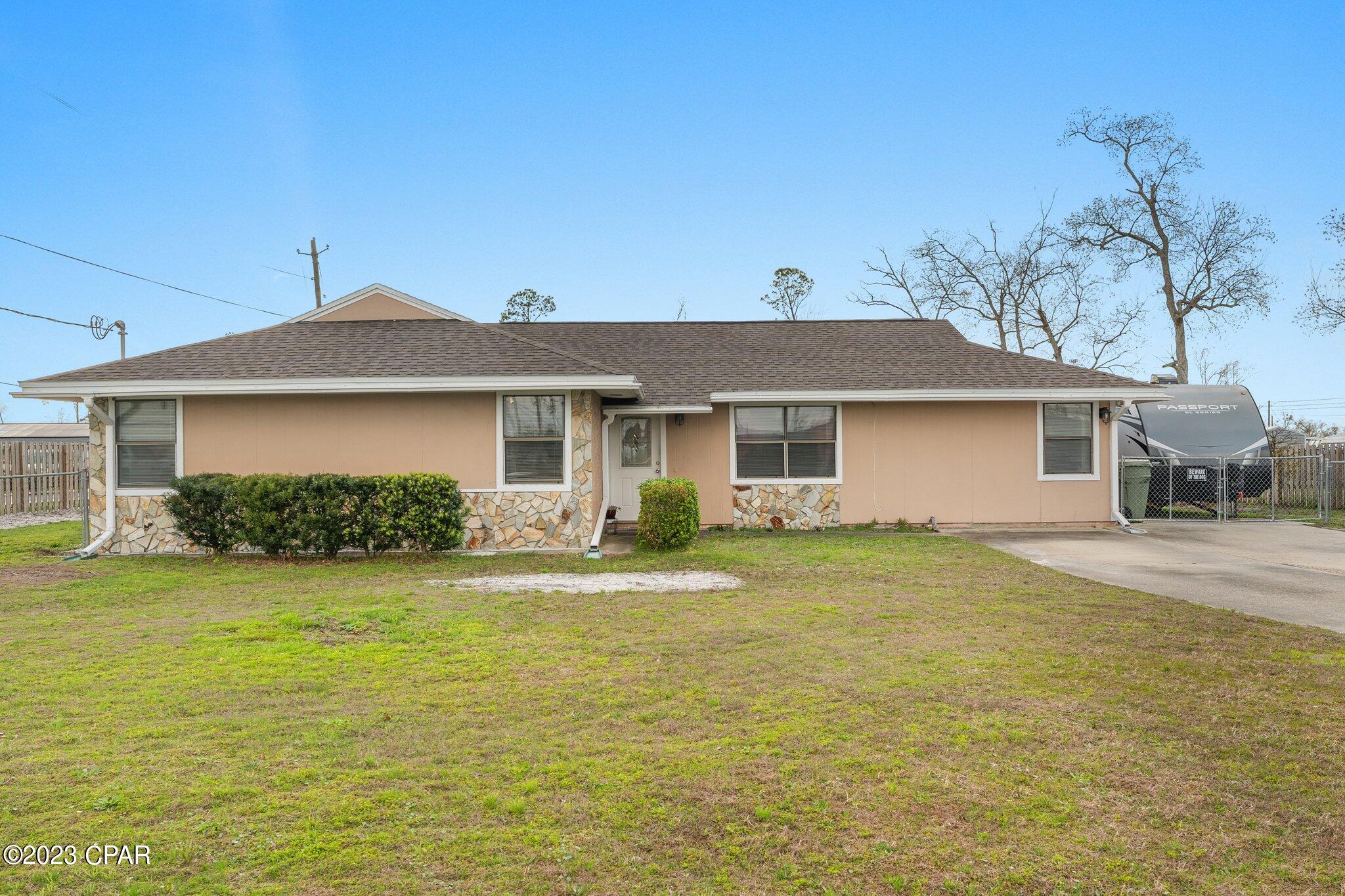 CURRENTLY UNDER CONTRACT, SELLER WILL CONSIDER BACKUP OFFERS

Welcome home!  Location, location, location!  In the heart of Lynn Haven, across the street from Cain Griffin Park & splash pad - something for everyone!  This affordable home is ready for you to move in!  Large corner lot with fully fenced backyard & workshop/shed. Space to park a camper or boat with a 30 amp outlet available!  Perfect yard to put in a large pool! Large flex space/office or craft room in addition to the 4 bedrooms!  Minutes to everything - shopping, restaurants, banking, entertainment & more!
