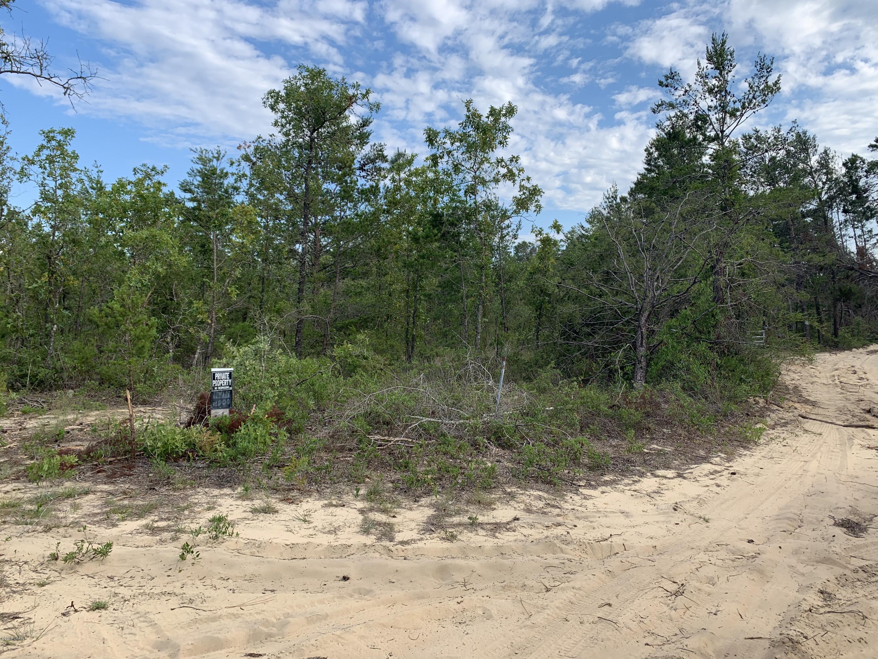 Nice piece of Vacant land just behind Sunny Hills. High and Dry. Horses welcome..Why by 1/2 ac lots in there when you can have almost 5 acres at the end of a dead end rd for peace and quiet. Still just a stone throw from the golf and fishing of Sunny Hills. You are about a 40 minute ride to the worlds most beautiful beaches in Panama City. 15 minute ride to I 10 if you want to travel to Tallahassee, Jacksonville, New Orleans or Pensacola. Walmart is about 15 mins away but you have the Dollar general just up the street for any quick needs. You are also only about 25 mins to the Northwest International Airport if you need to fly somewhere in a hurry.. Get your private showing now. Mobile homes allowed
