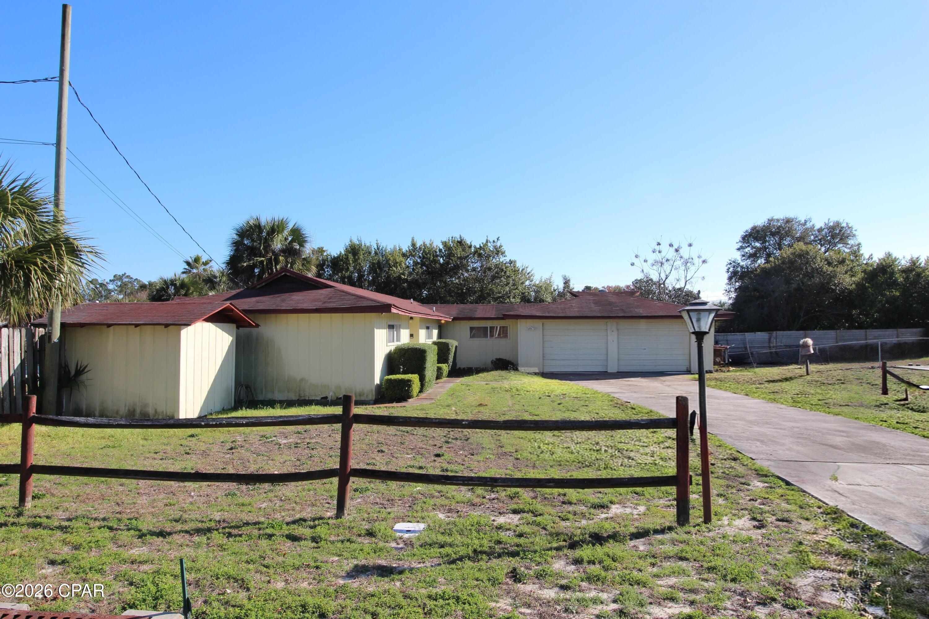 Attention all Investors!!  Owners are READY TO SELL!! This home needs the perfect visionary and is a great fixer upper.   Property is in need of a little TLC and design ideas.  Perfect for a primary home, second home or rental property.  Property is sold ''As Is''.  Home has the following features; living room; dining room; family room; kitchen; 3 bedrooms; two baths; two car garage; in ground pool, etc.  This site is 120 x 120 or .33 acres.  Property is conveniently located near the beautiful beaches, Pier Park, Restaurants; Shopping; The Pirate Show; and Top Golf.  Located in Lullwater Beach Community.   Don't miss this opportunity!!