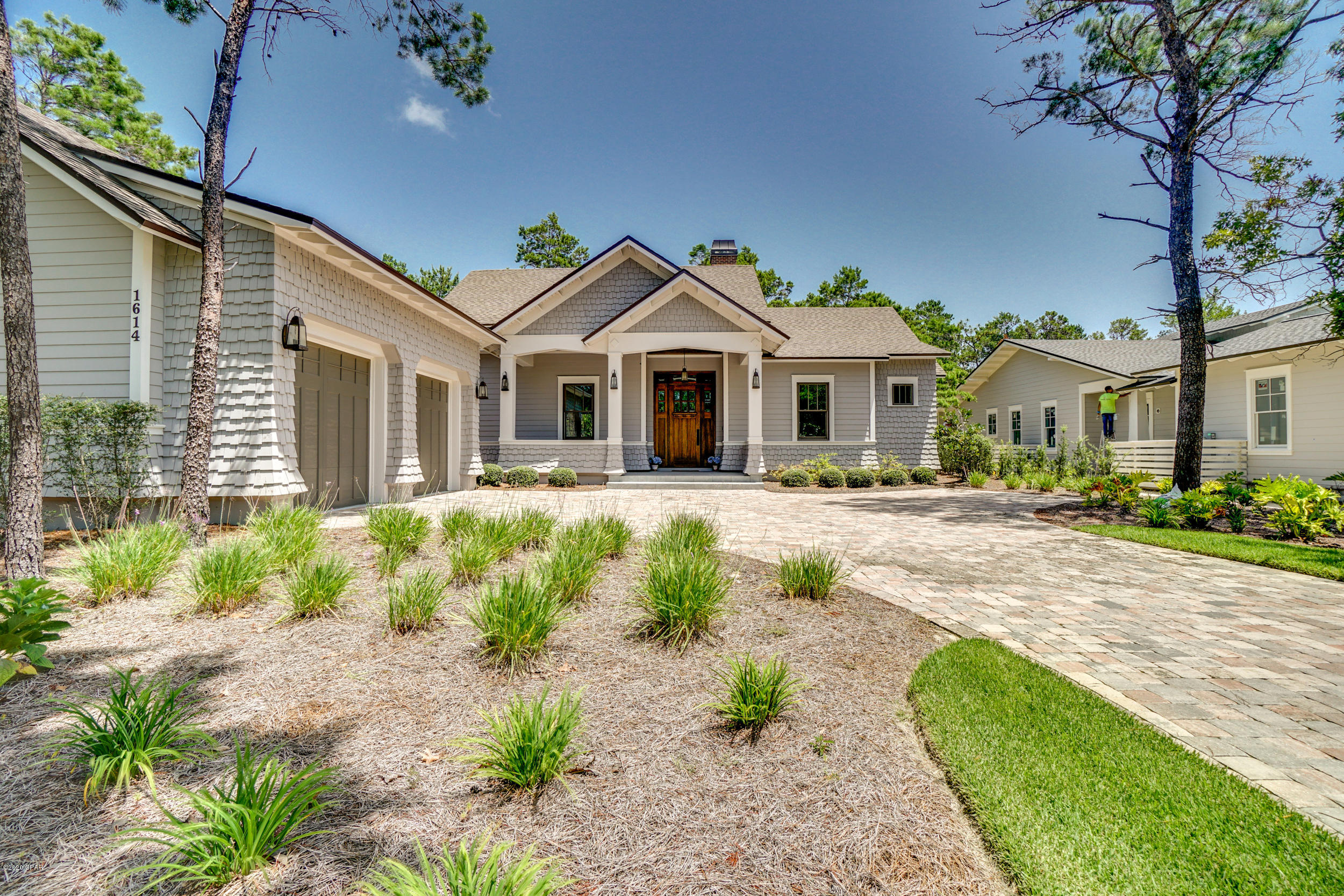 UPON entering the guarded gates of Wild Heron you realize that you truly have entered a ''Coastal Sanctuary''!! The peaceful transition from the hectic, over crowded areas of the beach, is certain to impress you with a feeling of Calm, and a oneness with nature. Nestled on the shores of Lake Powell, and the home to Sharks Tooth Golf Club, Wild Heron sits on 750 Acres of well planned tranquility and fabulous amenities. 1614 Lost Cove overlooks the golf course, through a privacy barrier of mature trees,and given the well planned placement of this home, privacy and view are protected. One story living with a split master bedroom, Open living, kitchen, and dining opening to generous covered porches. Hardwood floors throughout, excluding baths. 10 and 12 ft. ceilings throughout. Must see!!