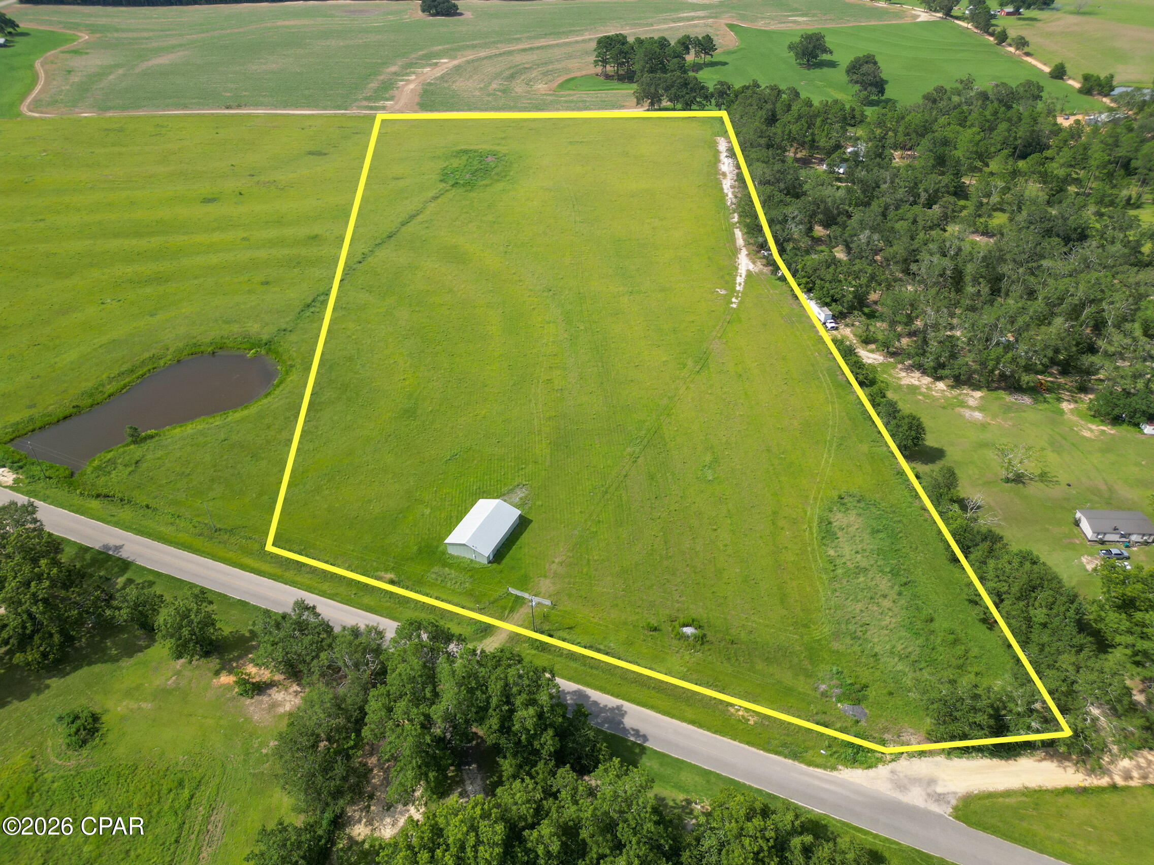 Escape to the perfect blend of location, convenience, and opportunity with this beautiful 16.42-acre property in Holmes County, Florida! Positioned at the intersection of Highway 79 and County Road 160, right next to Dollar General Market, this property offers easy access while still delivering the privacy and charm of country living. Enjoy being just a short drive to the stunning beaches of the Florida Gulf Coast, making weekend getaways to white sand and emerald waters easier than ever. Parcel 4 is already equipped with a 32' x 48' enclosed barn featuring a concrete slab and electricity--a major bonus perfect for a workshop, equipment storage, or agricultural use from day one. Whether you're dreaming of building your custom home, enjoying peaceful country living, or securing a smart land investment, this property offers endless potential. Recorded deed restrictions are in place to help protect your investment. Seller will record an additional deed restriction at closing requiring any manufactured/mobile home to be a 2016 model year or newer and limiting the property to one (1) manufactured/mobile home per parcel. Survey and deed restrictions available upon request.