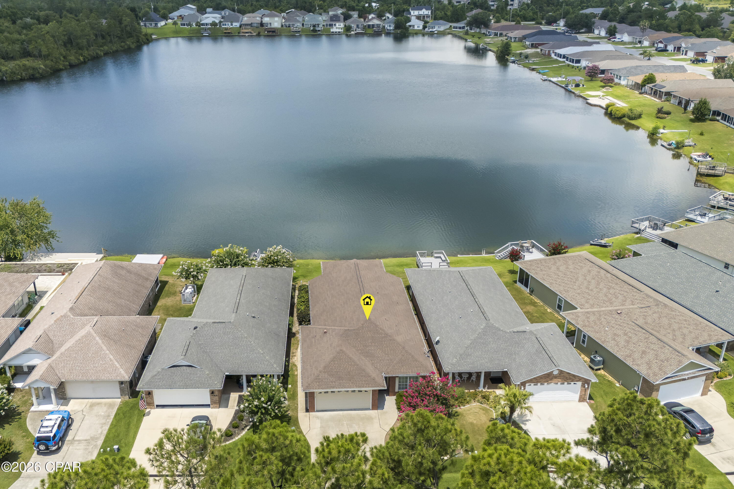 Experience the best of lakeside living on beautiful Lake Marin! This well-maintained 3 bedroom, 2 bath home features a desirable split floor plan designed for both comfort and privacy. The spacious living and dining areas flow seamlessly into a large family room, where expansive lake views create the perfect backdrop for everyday living.

Step outside to your private backyard oasis and unwind on the patio. Ideal for grilling, entertaining, or simply soaking in breathtaking sunset views over the water. Enjoy endless outdoor recreation with fishing, kayaking, and paddle boarding right from your own backyard.

Conveniently located near shopping, dining, schools, and medical facilities, this home offers the perfect combination of peaceful waterfront living and everyday convenience. This Lake Marin home is one you won't want to miss!