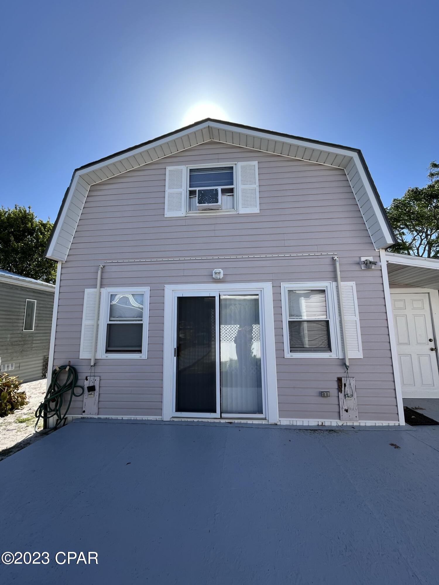 Cozy beach rental located south of Hwy. 98 making it an easy walk or bike ride to catch those beach sunsets. Located in a quiet residential area, this guest home sits on the back of the lot with owners living in the front residence. Downstairs is a kitchen, bathroom and small sitting area, with a spiral staircase taking you upstairs to an open bedroom. Home is very clean, and well suited for one person. Tenant pays for internet and cable, all other utilities included. Sorry, NO PETS AND NONSMOKER ONLY PLEASE.