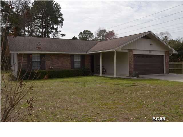 Amazing price on this well kept 3 bedroom, 2 bath home located on a corner lot in Lynn Haven. This home has been well maintained with a new roof in 2004, new A/C in 2014, a finished Florida room with a separate A/C and wired with 220 for a hot tub and many new fixtures throughout the home. The seller is only the second owner to ever live in the home and it shows well! The living area is very large and opens to the Florida room and the dining room. The kitchen is a galley style kitchen with plenty of cabinet space. All three bedrooms are quite large too. The exterior of the home has brick and wood siding that has been well maintained also. The water heater is on a timer for efficiency and the garage door opener was just serviced too. In the back yard there is a 12x20 workshop and