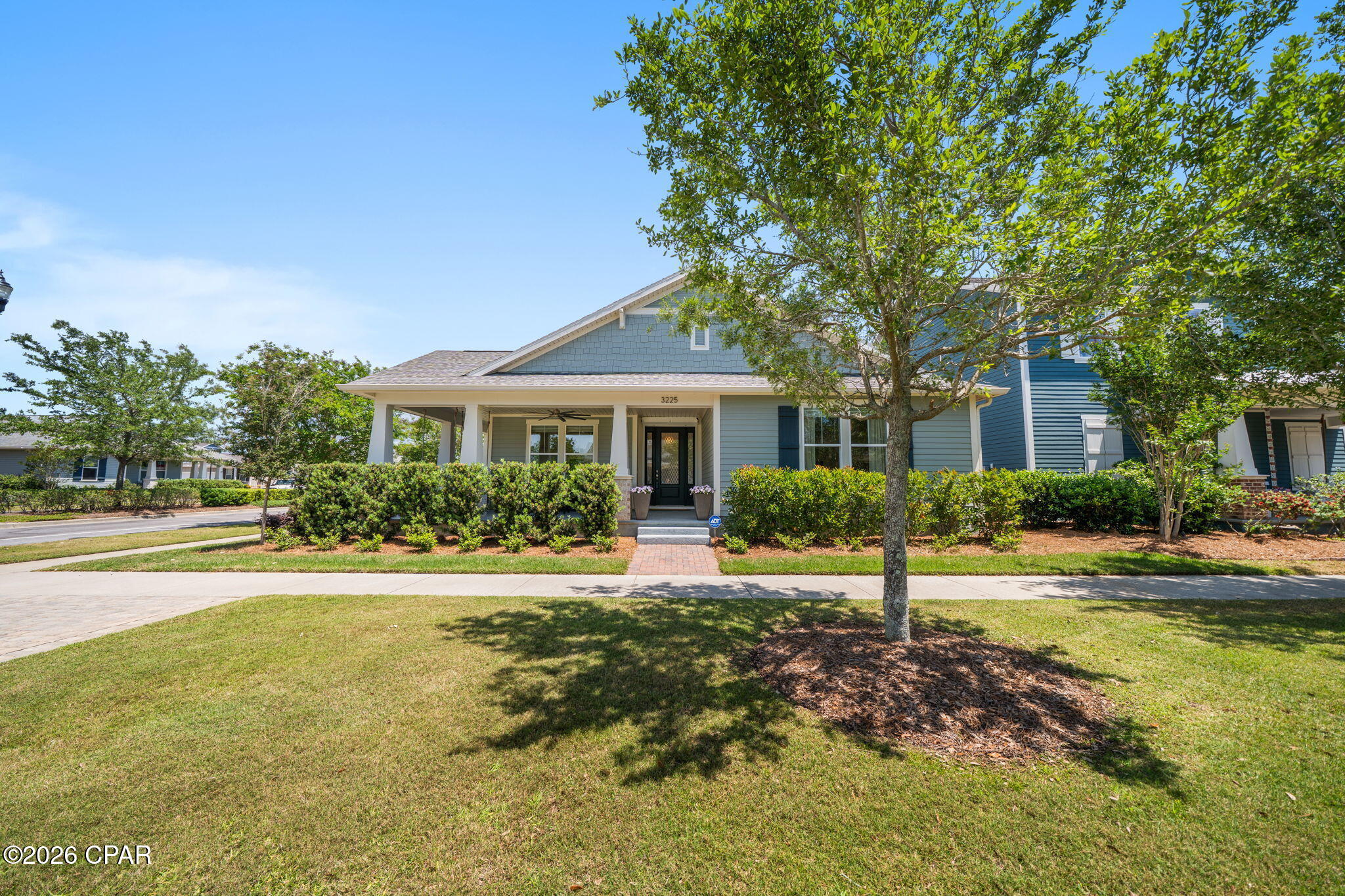 This property is a beautifully maintained corner-lot home perfectly positioned on green space and just moments from Kestrel pool and University Academy. With 4 bedrooms, 2.5 baths, and thoughtful upgrades throughout, this property offers the perfect space, function, and outdoor lifestyle. Inside, you'll find a well-kept home featuring all new stainless steel appliances, hurricane shutters for windows and doors, window treatments throughout, a whole-house security system, UV air filtration in the HVAC system, and wired for a whole home generator. The spacious laundry room is a standout with wall-to-wall cabinetry and direct access from the primary suite's walk-in closet for everyday convenience. The primary suite is designed to impress with double vanities, a tiled walk-in shower, soaking tub, and an oversized closet connected to the laundry room. The secondary bedrooms are equally impressive, each offering its own walk-in closet for plenty of storage and flexibility. A convenient half bath located just off the kitchen is perfect for guests. Step outside and enjoy your own private retreat. The backyard features an additional living space complete with a paver patio, covered pergola, gas fire pit, play set, and all outdoor furniture included -- ready for entertaining or relaxing from day one. The extended front porch with porch swing adds even more charm and curb appeal.

Living in SweetBay means more than owning a beautiful home -- it means enjoying a true lifestyle community with miles of walking trails, multiple resort-style pools, parks, playgrounds, green spaces, bayfront access, and community events throughout the year. Residents love the golf cart-friendly atmosphere, scenic surroundings, and convenient access to shopping, dining, and everyday essentials.