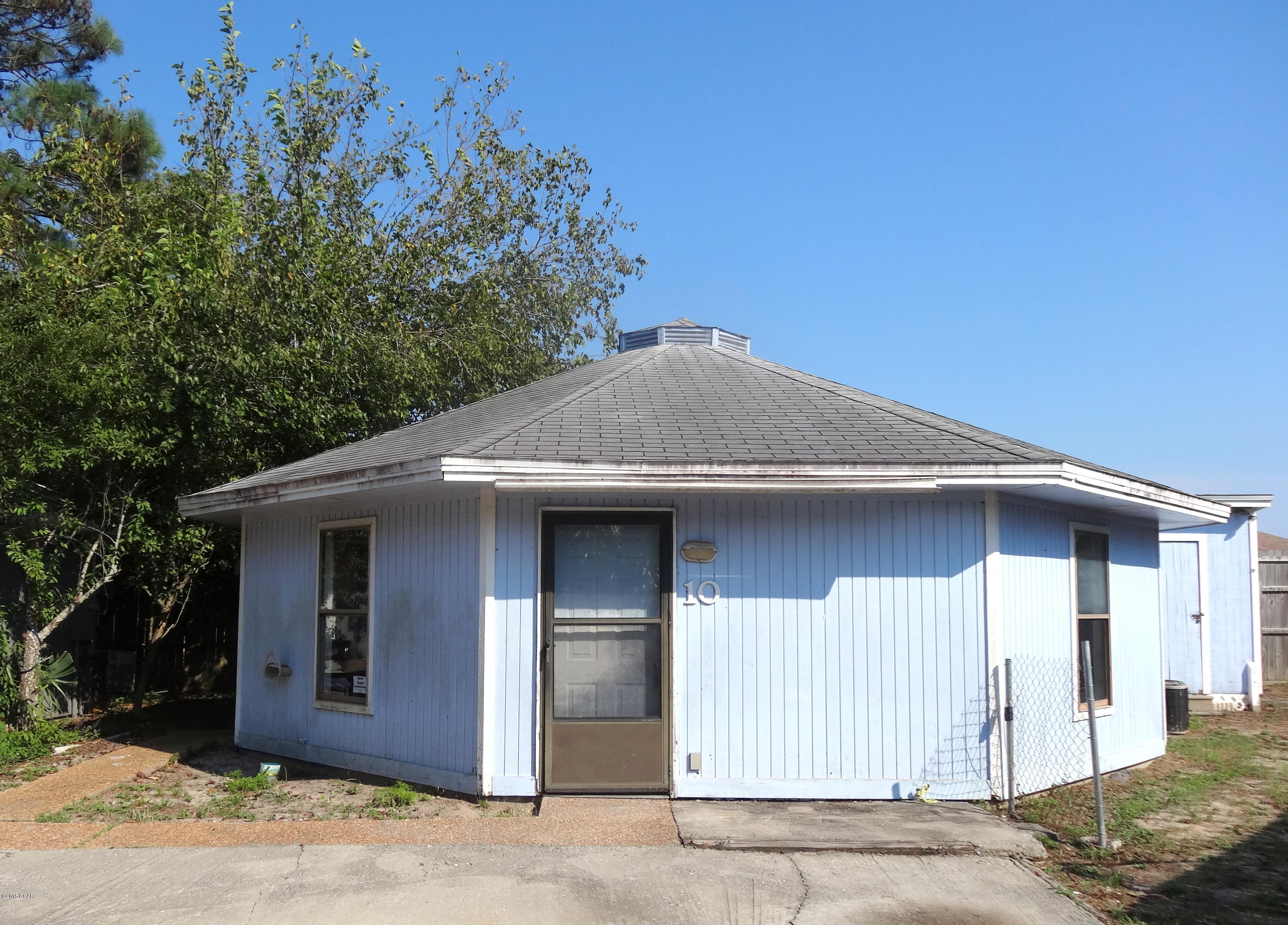 Cute little beach house located only 1/2 mile to the Treasure Island Marina and Gulf of Mexico. This octagon cottage features 2 bedroom, 1 bathroom with storage and washer/dryer hookups. Great for a first time home buyer! Age, Square Footage, room sizes approx, please verify.