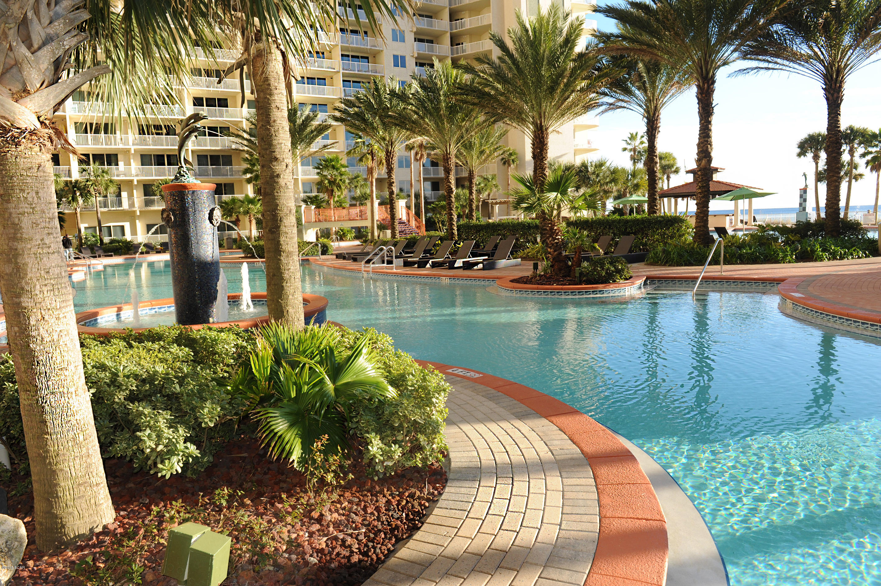 First floor beautifully furnished unit at Shores of Panama Resort with view of water and pool! Featuring 1 Bedroom and a Bunk Room, 2 Full Baths, Gulf Front Living Room, Master Bedroom with On Suite, 12ft Ceilings, Kitchen with granite countertops & breakfast bar. Shores of Panama, a 23 story condominium of gulf front luxury accommodations offering unparalleled amenities: 13,966 sq. ft. gulf side pool, Gulf side hot tub, Large heated indoor pool & hot tub, Covered on-site parking deck, Health center with fitness equipment, sauna, massage therapy and steam room, Two tiki bars serving lunch and dinner, Beach activities and rental services, Free high-speed internet access. Terrific rental place. Age, Square Footage, and room sizes approx, if important please verify.