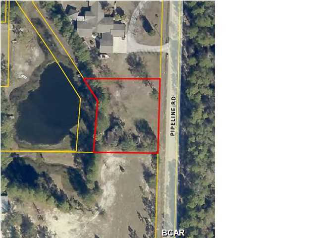 1/2 acre lot, 120 feet by 160 feet on a paved road with views of a small lake. This lot is high and dry and has county water and sewer available. Build your dream home here!!!