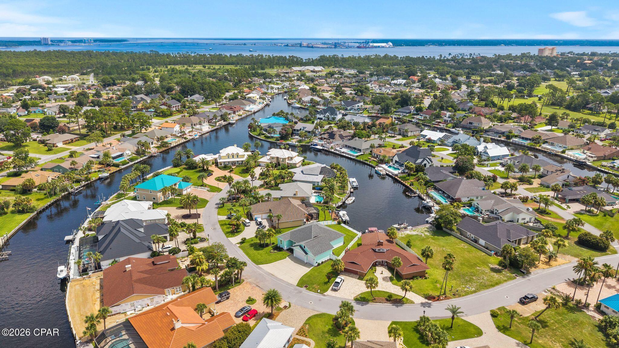 This beautiful canal front home was built in 2020 by Stacey Wilson using updated FL. Codes. The open floor plan with 12' sliding glass doors, practically erases the line between the inside and out. Moor your boat along the new 44 foot dock and seawall completed in 2024 and grill the day's catch on your expansive covered deck overlooking the canal. Inside you will enjoy the easy flow between the entertaining living room and your nicely equipped kitchen complete with propane fueled stove, oven and on demand Rinnai water heater. All of which are connected to a buried 250 gal propane tank. This beautiful home has 3 bedrooms, 2 full bathrooms and 1 half bath. 10' ceiling, 8' doors, trey ceilings in the primary bedroom and living room. The use of the large upstairs bonus room is open to your imagination. Add in the 24ft deep garage with overhead storage and 9' doors that allow for large trucks and other oversized toys, and you have the ultimate family home for Florida fun in the sun. New HVAC was installed by A Superior in 2024.