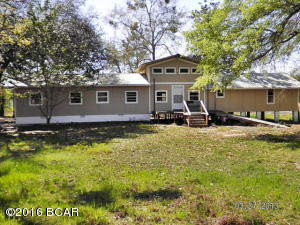 This house was 3 houses moved in and joined together, it needs lots of work but is very livable, the kitchen dining room and one bedroom and bathroom and living room is mostly finished, the home has original hardwood floors, high ceilings in the living room there is another 4 rooms that need to be finished, it has 4 ac of land on corner lot both roads paved, city water and sewer, no restrictions,also there is a 28x30 metal 2 car garage with concrete floors and 2 roll up doors, there is owner financing available on this home. THERE IS ALSO A 18X30 SCHOOLROOM ON THIS PARCEL THAT THE OWNER IS TRYING TO SELL, IT MAY OR MAY NOT GO WITH THE LISTING, IF YOU ARE INTERESTED IN BUYING IT CONTACT ME AND I WILL GIVE YOU MORE INFO.