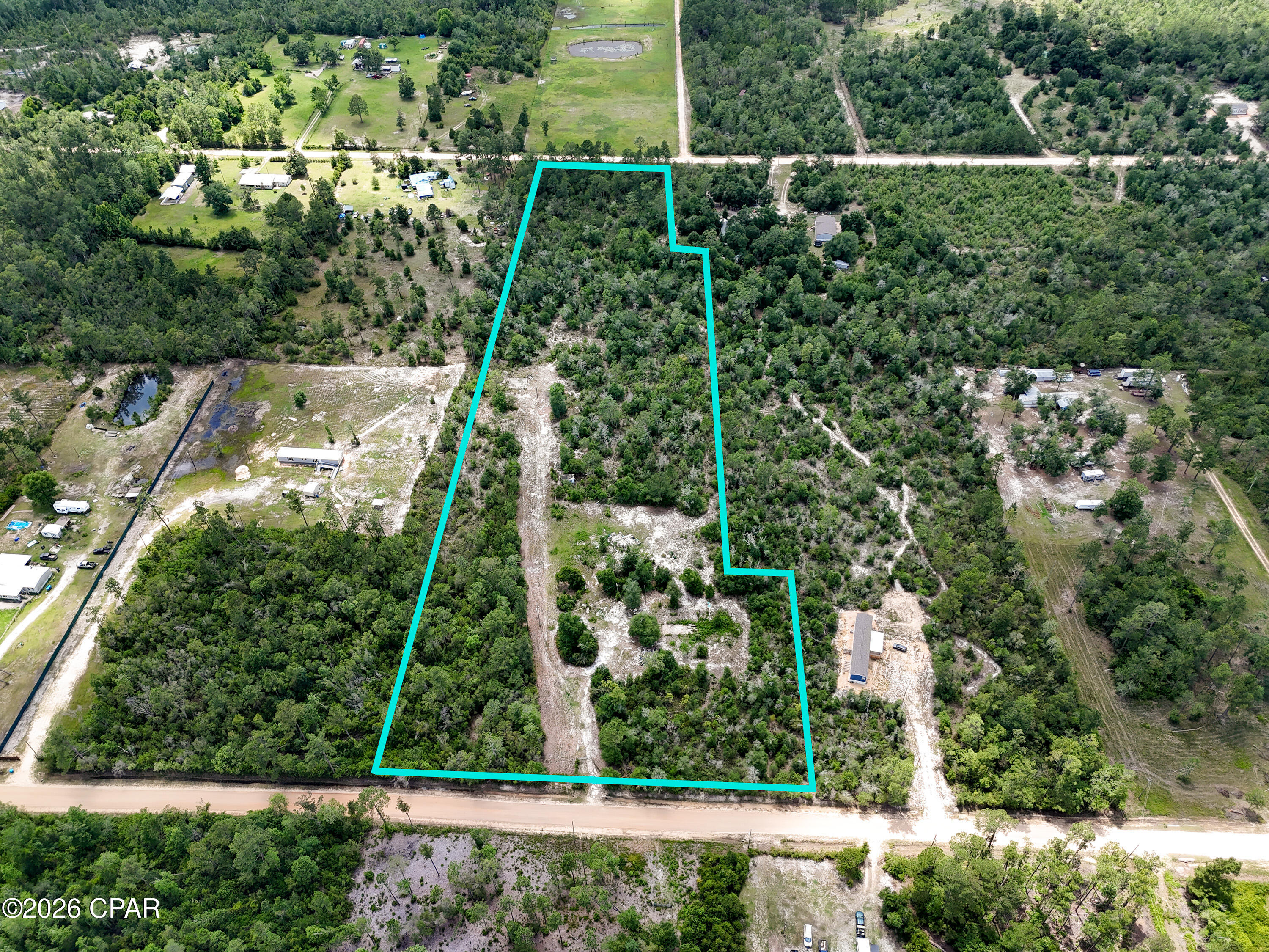 10 acres with two road frontage! Build your dream home or place a manufactured home on this high and dry property. The property had 2 old wells and an abandoned septic system. Multiple potential home site locations. Bring your horses or farm animals. Plenty of woods here! Located less than 1/2 mile off Owenwood Rd and on a county maintained road. The property is perfect for anyone needing a little ''elbow room'' or wants a mini farm. Only 35 minutes from shopping, dining, and the world's most beautiful beaches!