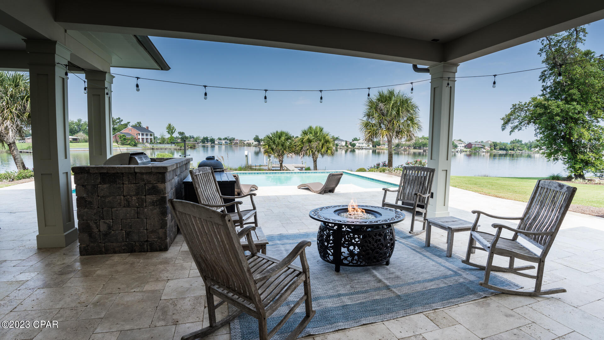 Beautiful Waterfront estate with 222' of deep water on Beatty Bayou offering wonderful sunsets, easy Gulf access and views of the Country Club.
 This custom designed home by J. Michael Hunnicutt is truly magnificent, with every feature designed for ultimate beauty and efficiency. There are 10 and 12 ft ceilings throughout with intricate coffered ceiling detail and 4 bedrooms, 4.5 baths, an office and guest suite over the 3-car garage. Additional features include whole house generator, electric car charger, tankless water heater, central vacuum, tile floors and heated saltwater pool along with a private dock with lift on the bay. Your outdoor kitchen sits poolside along with a large covered lounging area.
Appliances include Sub-zero fridge, Thermador induction cooktop, wine cooler, ice maker and Remi Halo purifier and gas fireplace.
All this situated on nearly an acre of high elevation property makes this the ultimate waterfront estate, call to view, you will not be disappointed!