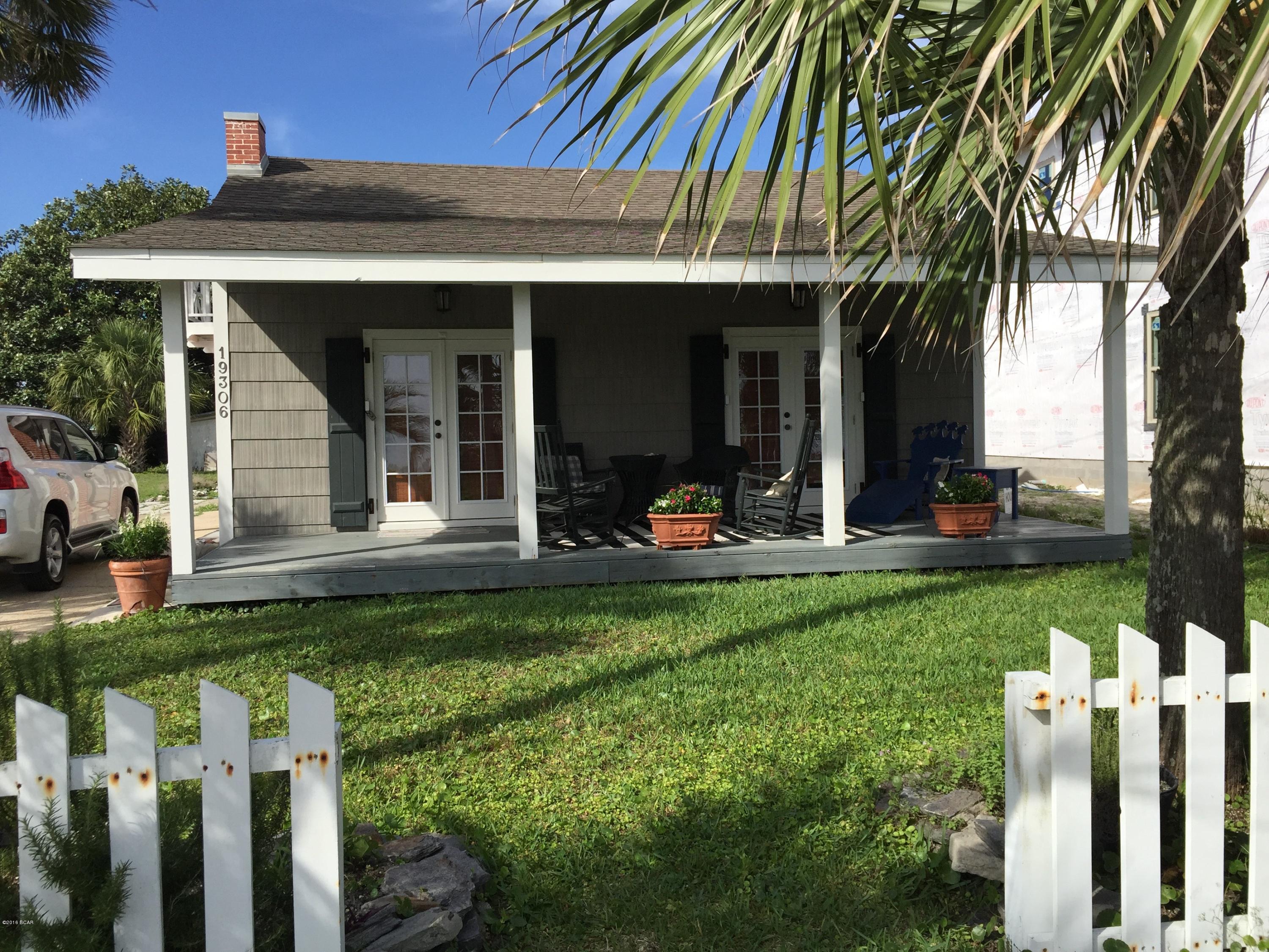 True Floridian Cottage in every way!  Sit on your 27' wide front porch and enjoy the INCREDIBLE VIEW! Located directly across the street from DEDICATED BEACH and short walking distance to both The Carousel Grocery and Thomas Donuts. If you think it couldn't get better....wait until you see the inside!  Every room reflects a welcoming charm.  Completely RENOVATED, and IMMACULATELY MAINTAINED. Includes an outdoor shower and storage room for your beach gear. GREAT RENTAL POTENTIAL. If you want to increase your rental potential, the cottage behind (MLS #643796) or Cottage behind plus 50' x 153'lot adjoining both cottages (MLS #643841) are also available!  Seller of this listing only (MLS#643797) is a licensed Real Estate Ag