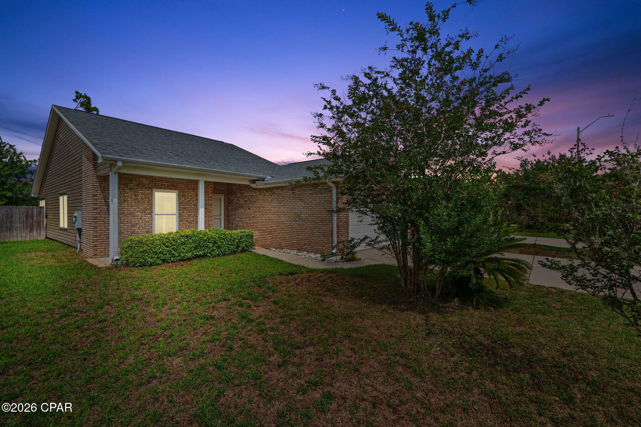 Check out this brick facing 3bd/2bth home located in the Brookwood subdivision in Lynn Haven with NO HOA fees! This home offers fresh new interior paint, brand new carpets throughout, and a new HVAC system!! Stainless steel appliances. Beautiful engineered hardwood flooring throughout the main living room with brand new carpets in the bedrooms. Updated and contemporary light fixtures in both the kitchen and living room as well as recessed lighting. Master suite has a trey ceiling and en suite with large walk in closet. Home also features a beautiful tiled screened in back patio, making a great space to enjoy the outdoors. Fully fenced in backyard with access to rails to trails walking path straight from your own back yard. Don't miss the chance to check out this adorable Lynn Haven home today! All sizes/measurements are approximate; please verify if important!