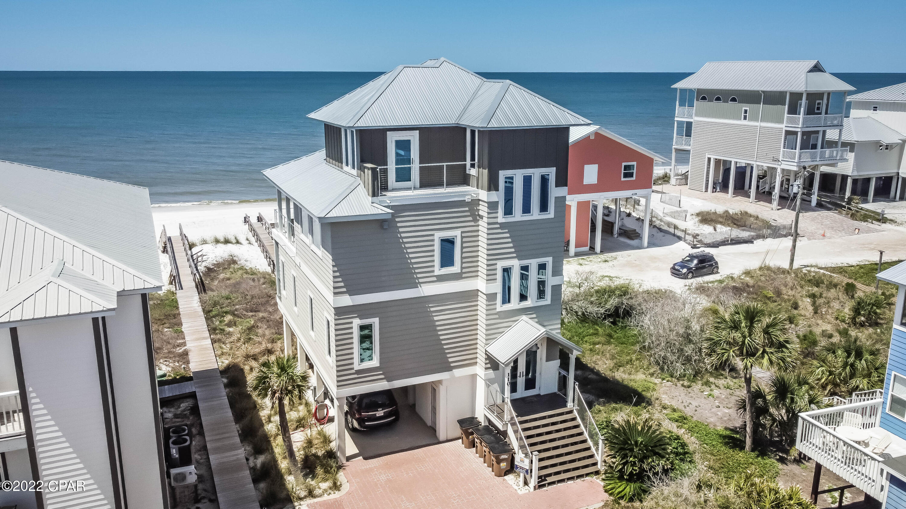 URRENTLY UNDER CONTRACT, SELLER WILL CONSIDER BACKUP OFFERS 
  EXCUISITE GULF FRONT home with massive income - With 4 sizeable bedrooms and 3.5 baths, this home features wonderful open space for easy entertaining inside and outside. The outside features an outdoor shower, and sink for easy fish cleaning and a lovely community pool, With an elevator that services all floors, you will find wonderful shiplap walls and ceilings and gorgeous kitchen cabinets with a true chefs dream kitchen. The kitchen has high end appliances, wine cooler, ice maker and prep sink that all overlooks the Glorious Gulf. You will absolutely enjoy spending time with your family and friends in this home, on the beach and enjoying all the Cape has to offer. Seller spared no expense on this renovation in 2018. A must see home. 3D tour link attached, call today.
