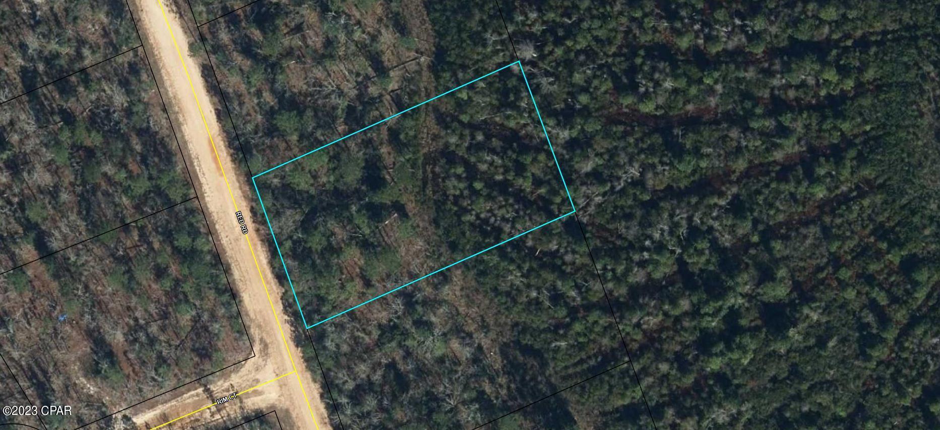 Nice wooded lot in Compass Lake in the Hills. It is a short distance off the main paved road of Nortek. Build your dream home or buy for investment. No mobile homes are allowed. Over 1 acre lot. There are several amenities available such as boat dock, club house and driving range for a yearly fee.