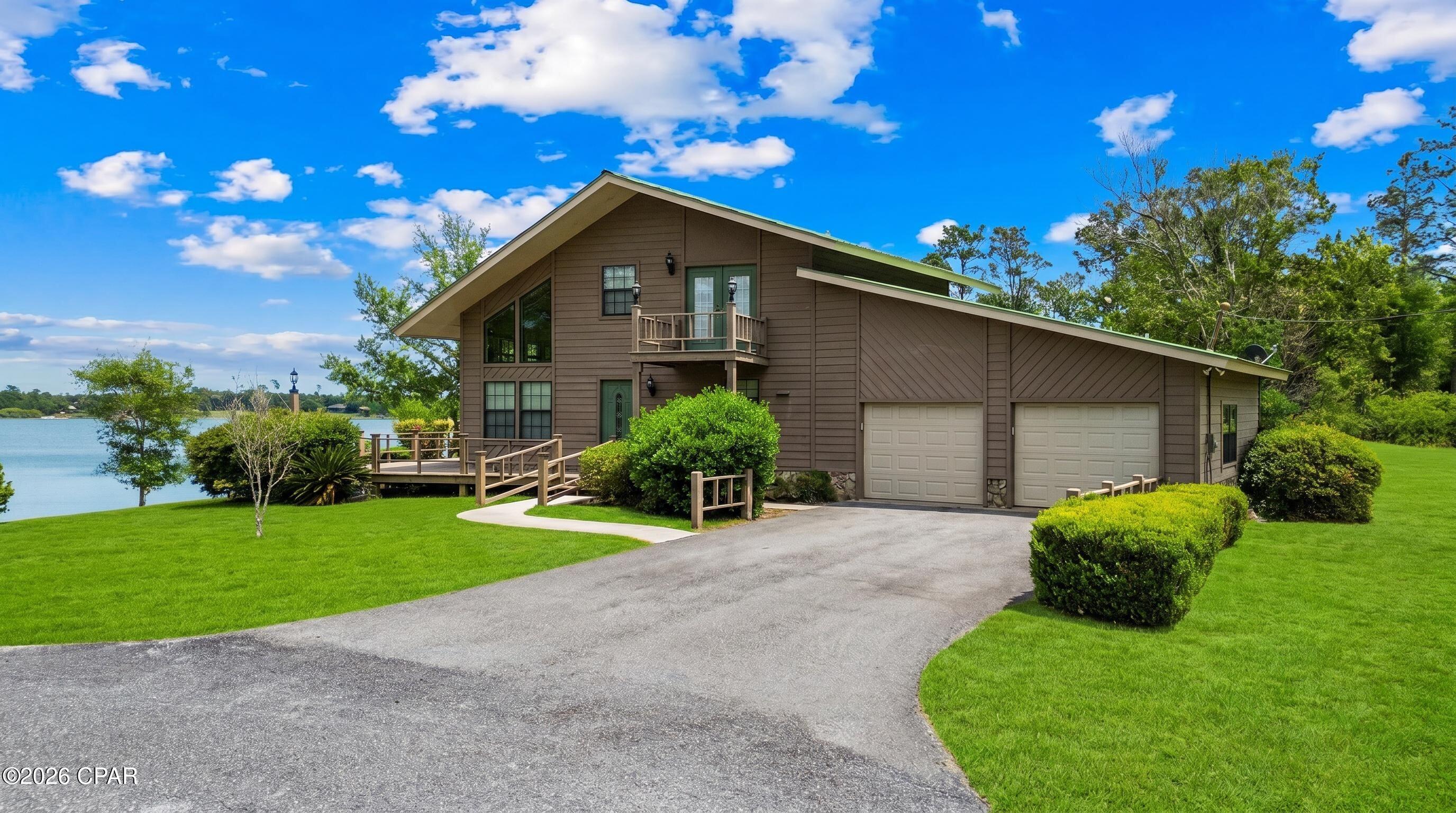 Discover the ultimate waterfront retreat at 84 S Silver Lake, a rare gem nestled on over 2 sprawling acres in the heart of Jackson County, Florida. This isn't just a home; it's a private sanctuary designed to celebrate its unique natural surroundings. Positioned perfectly, this property boasts a distinction unlike any other in the area, it sits on two separate lakes. Enjoy the peaceful expanse of Silver Lake to the front and a second private lake view to the rear, making this the only dual-waterfront lot on the lake. Pristine Waters: Silver Lake is renowned for its exceptional clarity. As a spring-fed lake, the water remains remarkably clean and crisp, offering a refreshing ecosystem for swimming, kayaking, or simply enjoying the view from your private shore. Gas motors are not allowed on the lake and the lake has no public access so it is tranquil 24/7. The residence was crafted to bring the outdoors in. Following Hurricane Michael in 2018, the home underwent a thoughtful refresh, including the installation of all-new windows. These expansive glass panes flood the interior with natural light and provide panoramic frames of the water from nearly every room. Step inside to find gleaming hardwood floors that add warmth and character to the open living spaces. Whether you're hosting a summer barbecue or enjoying a quiet morning coffee, the home offers an abundance of outdoor spaces, including: Deep, shaded porches, Expansive sun decks, Private balcony off the upper level. With over 2 acres of land, there is plenty of room to breathe, garden, or expand. This property strikes the perfect balance between a functional primary residence and a secluded vacation getaway. Experience the rare luxury of spring-fed lake life and the privacy of a double-waterfront acreage. 84 S Silver Lake is ready to welcome you home.
Schedule your showing today!