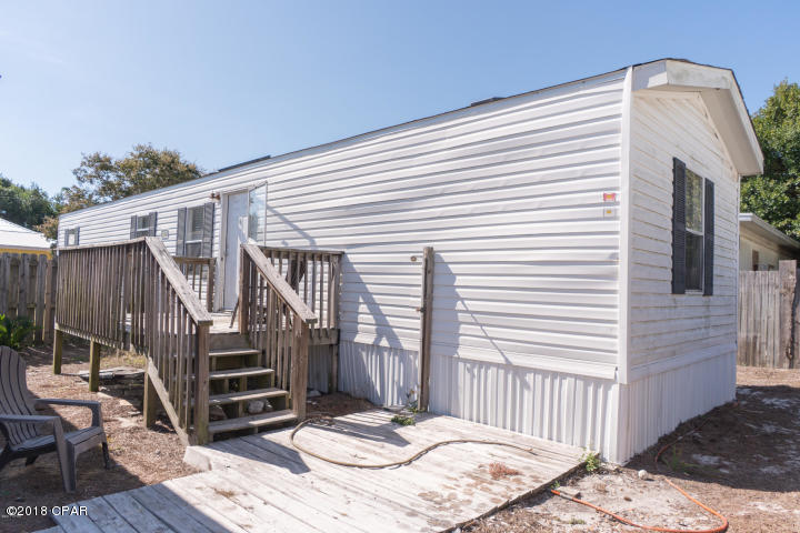 Recently renovated mobile home on the west end of the beach, and just a short walk to the beach.  This unit has vinyl plank floors, fresh paint through out, new a/c unit, and small deck out front.