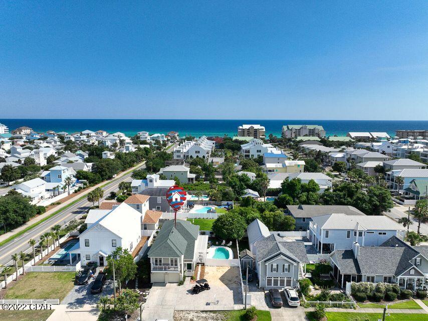 ''Simmply Summer'' a Spacious 5 Bed 3 bath vacation rental machine is 2 blocks from the Gulf of Mexico in the coveted Crystal Beach neighborhood. Feel the Gulf Breezes sitting by the Private Swimming Pool or on one of 3 balconies. Entertain seamlessly in the Open floor plan with Four Sets of Southern Style floor to ceiling French doors leading to patio and pool. Enjoy holidays at the Beach and generate income as a short term rental throughout the year. Central Kitchen features crisp white cabinets, stainless appliances, and butcher block center island. Cozy gas fireplace is flanked by built-ins. Build memories around the Dining table for 12 guests. Rainy days are even fun with ping-pong and foosball tables, TV and extra fridge in the garage.