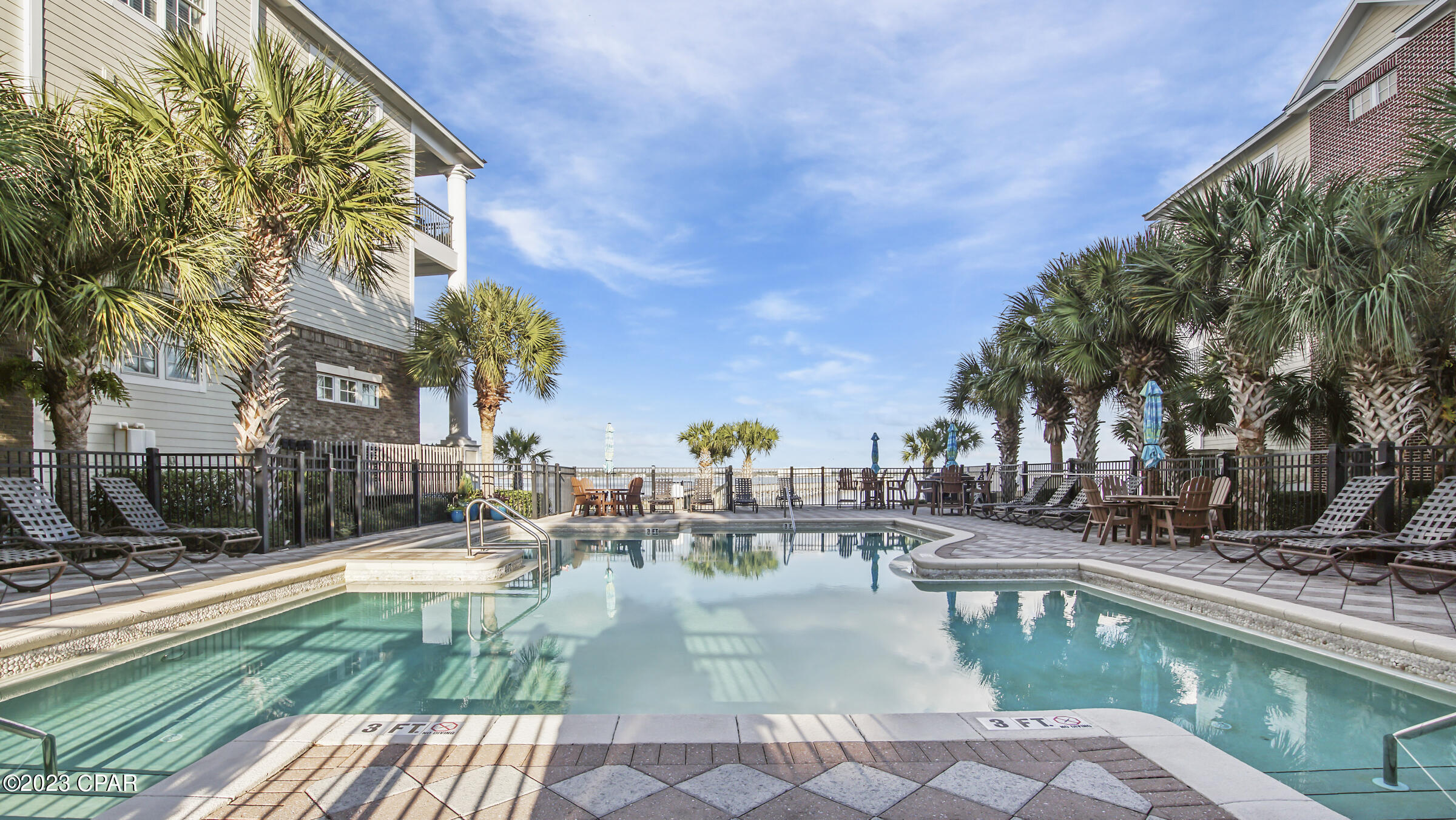 Upscale - Water front community located directly on St. Andrews Bay. Waterhaven is a gated, non-rental community unlike any other. This beautiful 3 story townhome includes 4 bedrooms, 4 ½ baths and separate carriage house over the 2 car garage that's perfect for family and friends. This open-concept living/dining area leads to a high-end kitchen including a Sub-Zero refrigerator, Viking 6 burner stove with convection oven, Bosch dishwasher, ice maker and Sub-Zero wine chiller at the wet bar. The pantry and laundry room are located in between the garage and the kitchen. Through the French doors in the dining room, you can relax in your own private courtyard. From the built-in bookcases in the living area to the crown molding throughout, you'll want to call this house your home. Enjoy the bay view lounging at the pool or enjoy a walk along one of the largest private piers in the area. Club house includes movie theater, meeting room, kitchen, fitness center and outdoor kitchen. Must see to appreciate this gem!