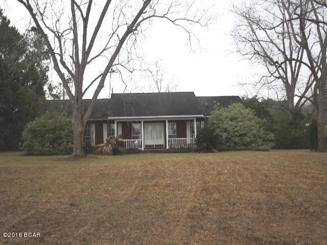PRICE REDUCTION!! Beautifully maintained home in the country but just a short drive into town for access to all local amenities. The home has that open airy design for the living/dining/kitchen area with classic archways between the living and dining rooms. Triple French doors line the dining room wall. There are maple cabinets with cherry trim in the spacious kitchen that features a smooth surface range, oven, dishwasher. There is a 2 car attached carport. All of this is situated on a large acre lot.