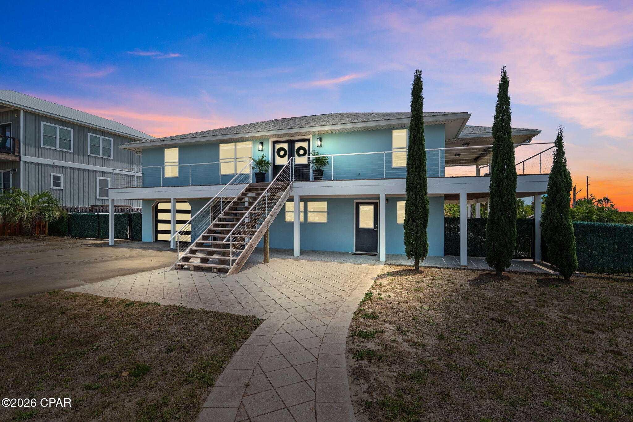 Positioned in the quiet stretch of Port St. Joe Beach, 118 Pine St offers a strategic blend of location, value, and flexibility--nestled perfectly between Port St. Joe/Windmark Beach and Mexico Beach. Just steps from the white sandy shoreline, this property delivers the coastal lifestyle buyers want without the premium pricing and elevated insurance costs typically associated with beachfront homes.

Located in an area that continues to gain national attention, St. Joe Beach was recently voted the #1 beach in the U.S. by Southern Living. Known for its dog-friendly shoreline, low crowd density, and easy, convenient roadside beach access, this stretch of coast offers a more relaxed and accessible alternative to heavily developed beach markets--all while maintaining the same stunning Gulf views.

The home captures exceptional Gulf views, including breathtaking sunsets and a unique perspective of the point visible right from the primary bedroom. Outdoor space is a standout feature--rare for this area--with a generously sized yard that enhances both livability and rental appeal.

A major highlight is the 16x32 heated saltwater pool, installed in 2022 with no expense spared. Custom lighting and fountain features elevate the backyard into a resort-style setting, ideal for entertaining or relaxing after a day at the beach.

The layout is designed for versatility. The lower level includes a fully functional 2-bedroom, 1-bath suite with a full kitchen--well-suited for short-term rental income, multigenerational living, or hosting guests. Upstairs, the main living area features 3 bedrooms and 2 bathrooms, complemented by new flooring, updated exterior decking, a fully renovated guest bathroom with a tiled shower, and fresh exterior paint.

Additional features include a dedicated office space upstairs with potential conversion to a bunk room for increased occupancy, a 2-car garage, and a laundry room equipped with multiple hookups for convenience.

Located in Flood Zone X, this property provides added peace of mind while maintaining strong investment and lifestyle appeal. A rare opportunity to secure space, views, and income potential in one of the most desirable corridors along the Forgotten Coast.