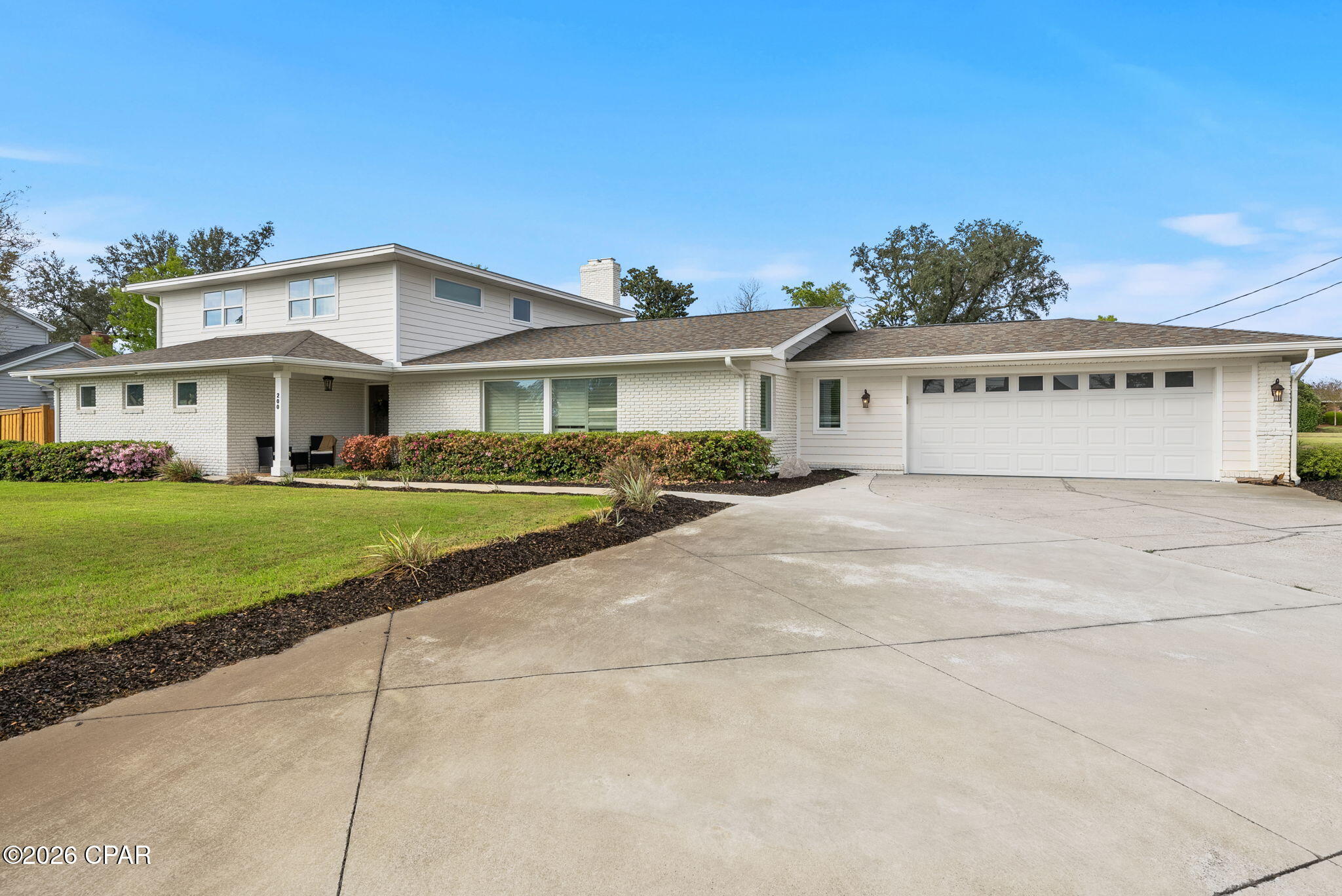 Welcome to an incredible opportunity to own a home in the heart of the Cove neighborhood, across from the Bay on a corner homesite! With NO HOA, this home is a rare find in the Cove and features a gorgeous saltwater-heated pool/spa, 2-car garage and over 3,000 square feet of living space. With 4 bedrooms, 3 full bathrooms and 2 half baths, this fully-renovated home offers ample storage, large closets, oversized bathrooms and high-end features throughout. Best part - it's on one of the most desirable streets in the historic Cove neighborhood!

Step into the entryway and you're greeted by an open concept with consistent flooring throughout, a large kitchen island, a brick-clad fireplace and large windows flooding the great room with natural light. This home was designed for entertaining! The expansive kitchen features an abundance of custom kitchen cabinets, granite countertops, Kitchen Aid and Frigidaire Professional appliances, a full-size walk-in pantry, wine refrigerator and a large kitchen island open to the living room and dining room. The living room with a brick fireplace features double French doors that lead to a covered patio and a stunning saltwater-heated pool and spa. The oversized great room has an accessible powder room for guests and also allows for a sitting room, additional family room and is open to the dining room, just off of the kitchen. 

The main level offers a primary suite with French doors leading to the patio, a large walk-in closet with custom built-ins and a spacious en suite bath. The en suite bath has a walk-in tiled shower, separate soaking tub and double vanities with quartz countertops. The upper level offers 3 additional bedrooms, two full baths and a half bath. This is an incredible option for guests or family members who share a bathroom with 3 vanities available on the same level! One bedroom has an ensuite full bath and a large walk-in closet with built-ins. Two guest bedrooms share a full bath and powder room accessible by the hallway. Consistent flooring throughout the upper level creates a great flow for the home. The bedrooms upstairs also offer great views of the Bay! 

The backyard is a true oasis! The covered porch is great for entertaining...imagine cooking s'mores and watching the kids play in the pool year-round. With a heated pool and spa, you will enjoy this great amenity with your friends, family and neighbors all year long! The corner homesites allows a large yard with lush landscaping and sod. A unique feature of this home is also a climate controlled storage room over 200 SF, accessible by the back yard. This gives the option to store items or also expand the primary bedroom walk-in closet for additional space or a larger laundry room. Possibilities are endless!

With a full interior renovation in 2021 and a full exterior renovation in 2022, this Cove home has been completed remastered! 200 Hollis Avenue has a beautiful white brick exterior, a unique and super functional drive-through 2-car garage and a luxurious pool. Extensive landscaping has been added to the home and a lovely addition of mature oak trees that complement the Cove neighborhood. There is a shallow well, an irrigation system with 4 zones and newer pool equipment. 

The Cove is a well-established neighborhood covered with hundred year oak trees and lovely neighborhood parks. With no HOA, this is a great place for those who wish to have all the toys, for kids and adults alike. This is a great opportunity to live in the Cove!