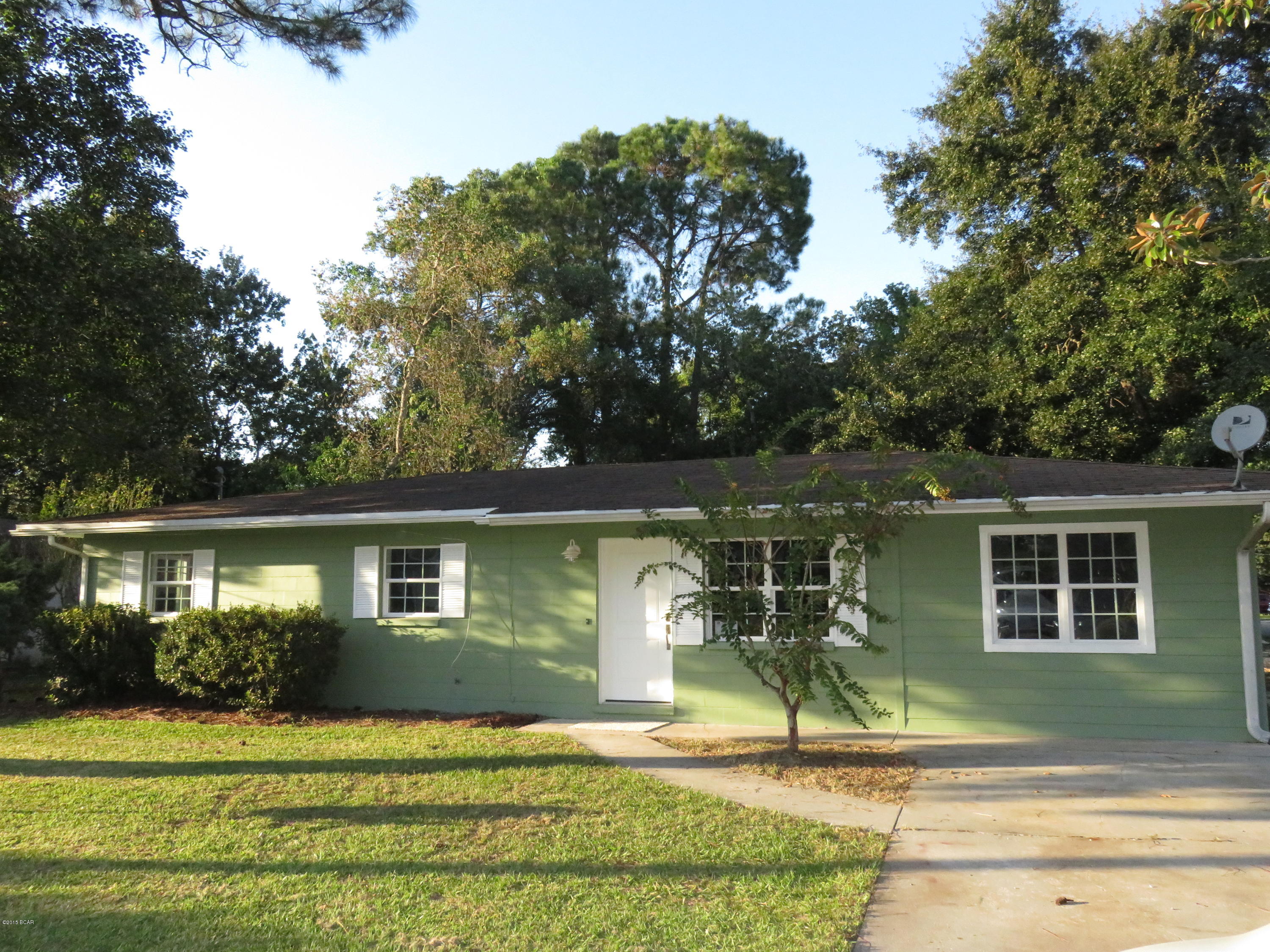 Completely renovated 3 bedroom 2 bath home in Lynn Haven with a bonus room. New kitchen cabinets, windows, tile and carpet flooring, paint, wiring, fixtures, etc. This home is like BRAND NEW! The kitchen features new dishwasher, stove/oven, and microwave and separate island for bar stools. The sliding barn door steps down into the bonus room or game room with connecting laundry room. The 3 bedrooms are spacious and the bathrooms feature new vanities.