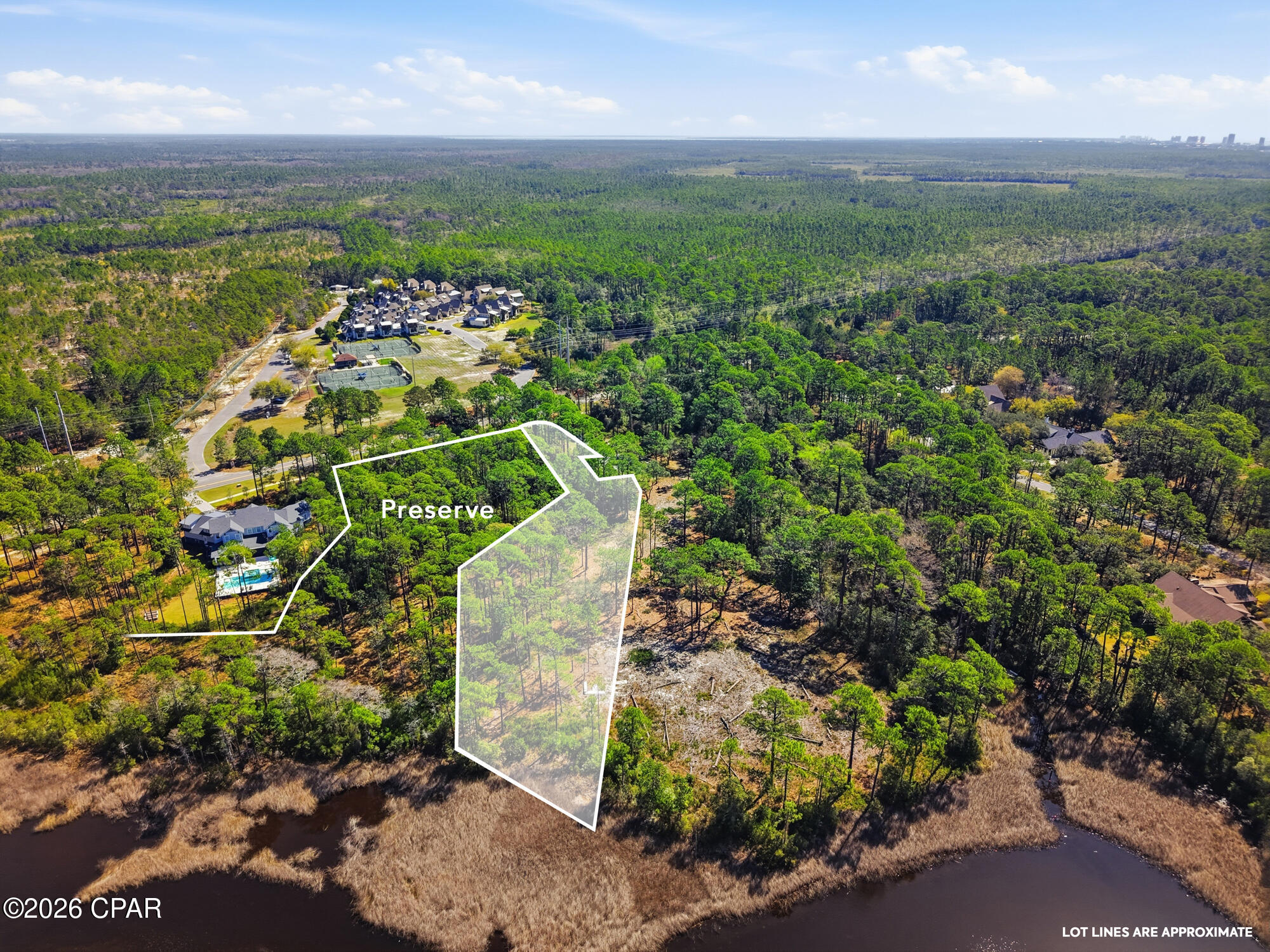 One of the largest waterfront homesites in Wild Heron, this exceptional 1.26-acre estate property offers a rare opportunity to build a custom luxury residence on the shores of Lake Powell, North America's largest coastal dune lake. Complete with a private boat slip, preserve frontage, and access to the Gulf of Mexico, this homesite combines privacy, natural beauty, and an unparalleled waterfront lifestyle. Lake views, protected preserve, and only one neighbor on a private road create an extraordinary setting for a one-of-a-kind coastal retreat. With over an acre of prime waterfront land, there is ample space to design a remarkable estate with resort-style outdoor living, a pool and guest houses with nearly 20,000 buildable sq feet. Located within the exclusive gated community of Wild Heron, residents can enjoy the scenic walking trails around Greg Norman-designed Sharks Tooth Golf Course, a lakeside boathouse, resort-style pool, fitness center, tennis and pickleball courts. Just minutes from 30A, Rosemary Beach, and the Gulf's white-sand beaches, this property offers the perfect balance of luxury, recreation, and coastal serenity. Rarely does a homesite of this size and caliber become available. Offering lake frontage acreage with only one neighboring lot, preserve views, a private boat slip, and access to one of the world's rarest coastal dune lake ecosystems, 22100 Trumpet Trail is an exceptional opportunity to create an unbelievable waterfront estate! With its generous footprint, this lot provides flexibility for an expansive estate with ample outdoor living, ability to add a pool overlooking the water and room to truly maximize the setting while being positioned up against a large preserve area for added privacy. Being unburdened by joining the wait list, the included boat slip at the community dock elevates the lifestyle even further, offering a feature that is incredibly limited within the community.

Wild Heron is known for its blend of luxury and nature, featuring 24 hour gated security, the Greg Norman designed Sharks Tooth Golf Club, resort style pool, fitness center, walking trails, and waterfront parks. Whether you are looking to build a primary residence, second home, or long term investment, this homesite checks all the boxes. All of this just a short drive to 30A, Rosemary Beach, and the Gulf's white sand beaches, giving you the best of both privacy and proximity. With ongoing discussions of a connection in the future for improved connectivity, including direct access from Wild Heron to Watersound Origins and Highway 79 leading to Northwest Florida Beaches International Airport (ECP), the long term growth potential within the community is significant.

Opportunities like this, with size, location, and boat access, rarely come available in Wild Heron. Inquire today to learn more about this opportunity.