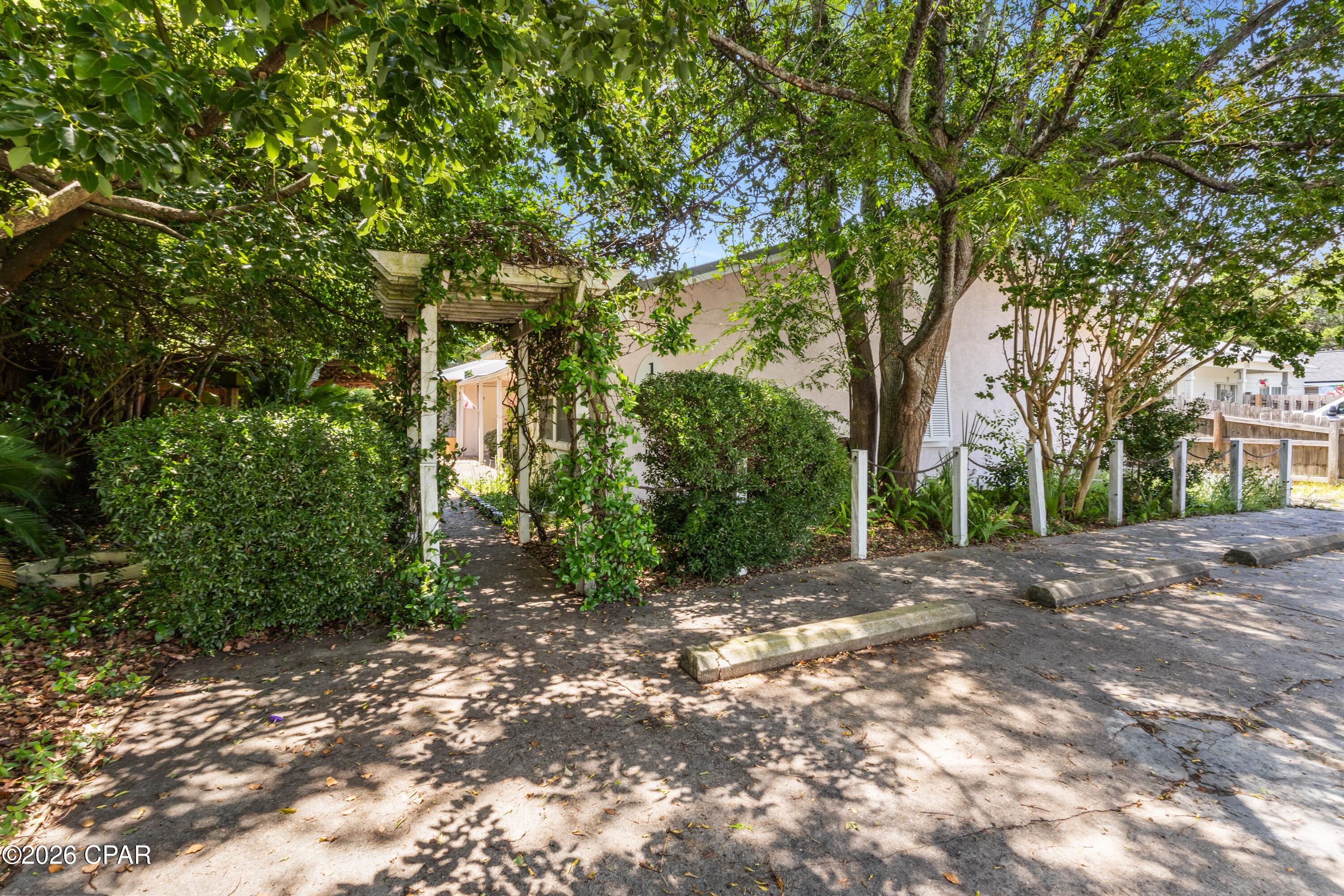 What's Special:
2 self-contained units

Ample parking

Mature shade trees

Covered patio

Walking distance to the beach

Welcome to 132 San Vincente!

This cottage is perfectly positioned within walking distance of the iconic white sandy beaches and several restaurants, and just 1.5 miles from Pier Park with all of its entertainment options. This property is located in a short-term rental and golf cart-friendly neighborhood.

There are two self-contained units.

Both Unit A and Unit B are 1-bedroom, 1-bath units with tile flooring throughout. Each unit features a pantry, ample closet space, a breakfast bar, dishwasher, washer/dryer, and plenty of shelving.

Unit B also features a large carpeted, closet-lined addition with double-paned windows and a brand-new AC/heat unit. This space could be used as a bedroom, hobby room, or playroom.

There is a covered patio tucked away for privacy from the street, featuring two porch swings. The property also includes a small, fully fenced backyard.

Nearby Attractions:

Frank Brown Park is just 2 minutes away and offers:

Public swimming pool

Dog park

Skate park

Sports facilities

Playground

Home of Gulf Coast Jam

Conservation Park is 5 minutes away and boasts:

24 miles of walking and biking trails

2,900 acres of natural beauty

Pine forests, wetlands, and cypress domes

This home features a metal roof.

Recent upgrades within the last 5 years include:

New HVAC system in Unit B

New water heater in Unit A

New refrigerator and dishwasher in Unit A

Expand your investment portfolio or enjoy a beachside getaway that could help pay for itself. Live in one unit and rent the other, or maximize income potential with short-term rentals in this highly desirable beach community.