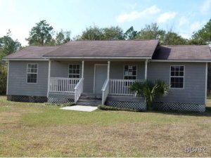 Convenient to Lynn Haven, quiet area, large yard with deck. Carpet in bedrooms, laminate in living room and halls vinyl in kitchen and utility room.