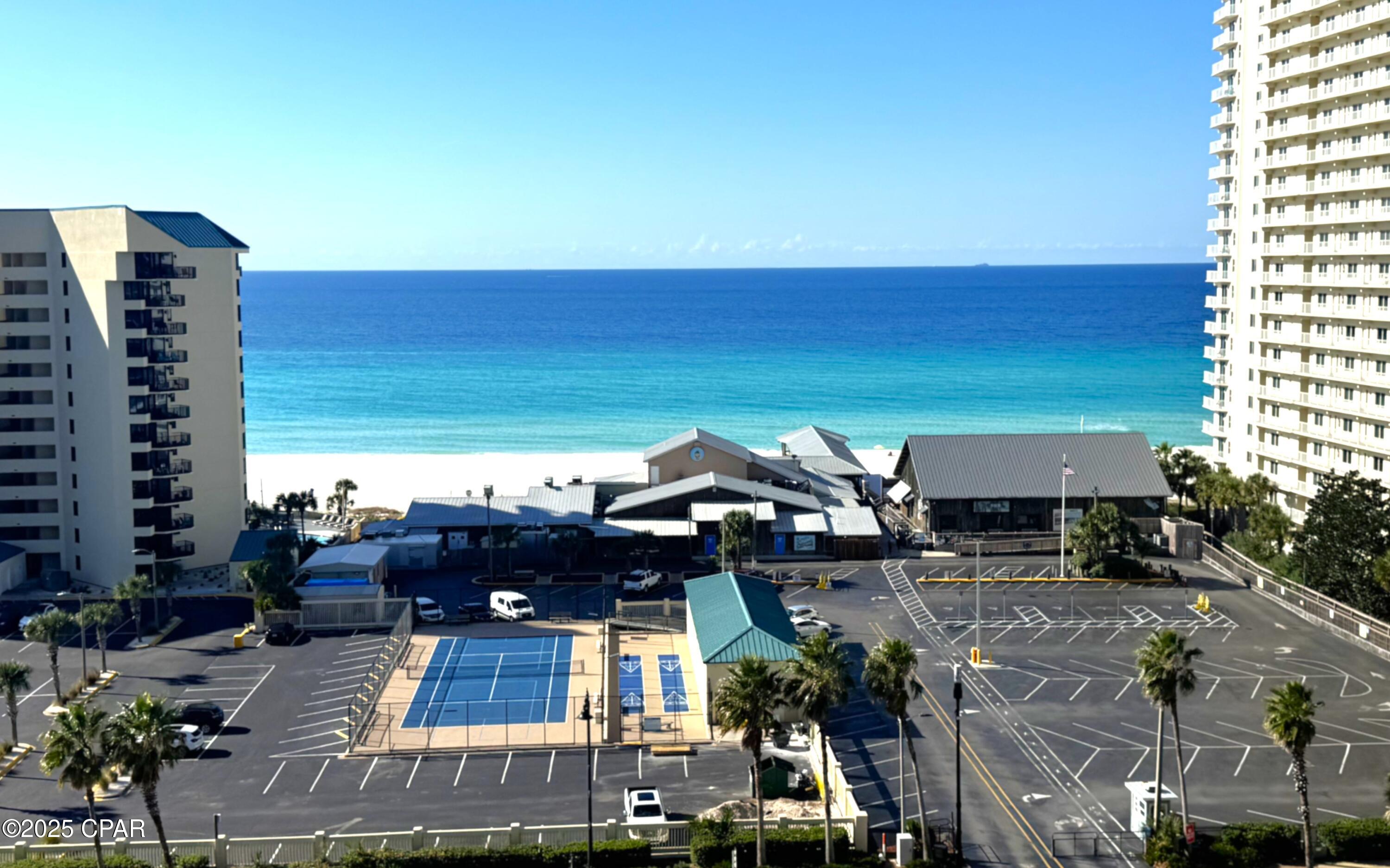 ** PRICE REDUCTION **Spectacular Gulf-Front Condo at Laketown Wharf Resort
Step into a premier resort lifestyle with this beautifully maintained, TURN-KEY, 2-bedroom, 2-bath unit w/ bunk room (approx. 1,262 sf) located on the 9th floor of Laketown Wharf Resort in Panama City Beach. This condo features designer finishes, luxury vinyl plank flooring, updated light fixtures, stylish ceiling fans and barn door to the bunk room. Enjoy sweeping Gulf views from your private, large balcony--perfect for sunrise coffee or sunset cocktails.  Relax or entertain in the spacious living/dining area with an open kitchen layout featuring modern appliances and a kitchen island. The generous master suite boasts an en-suite bath and ample closet space.  Beyond the unit, you'll enjoy resort-style amenities including five shimmering pools, two hot tubs, tennis courts, pickle ball, 24-hour security, covered parking, nightly light show, on-site restaurants and -- all steps from the beach. The new bowling and billiards, located on the first floor of the parking deck, also gives you a rainy-day option.  It's great for date night, watching football or just letting the kids blow off some energy. Whether you're looking for a second home, vacation rental investment or full-time residence, this condo is a rare opportunity. ***$2500 lender credit available. Schedule your viewing today -- opportunities like this don't last long!