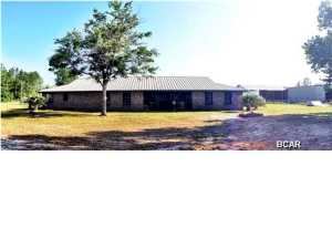 Beautiful red brick 4 bedroom, 2 bath ranch style home with in-ground pool on 2.2 acres featuring gorgeous hardwood pecan floors, ash floors, and juniper walls throughout. Detached 40x51 workshop and 5 stable barn including tack room made out of hash wood. The spacious kitchen has plenty of counter space and storage for cooking and entertaining with double ovens, kitchen island, breakfast bar, pantry, and more. Large family room with cozy fireplace and separate dining room. The master bedroom boasts a large walk-in closet, walk-in shower, garden tub, and double vanities. Bonus room connected to master could be used as an office or nursery. Three additional bedrooms with a full bathroom. The large 6x12 laundry room has plenty of space and built in cabinets.