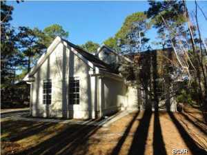 Beautiful traditional style home located in the Woodland Bayou Subdivision! Large, level lot! Living room has vaulted ceilings and large windows which let in tons of natural light! Kitchen features white cabinets, pantry, and separate breakfast area! Kitchen provides access to screened-in porch! Separate laundry room! Master bedroom on main floor features private bathroom and sliding glass doors to patio! Additional bedroom on second level with balcony! Second level also provides an additional bedroom and full bathroom! Bonus room with built-in desk space! A must see! Please show and submit your offer today!